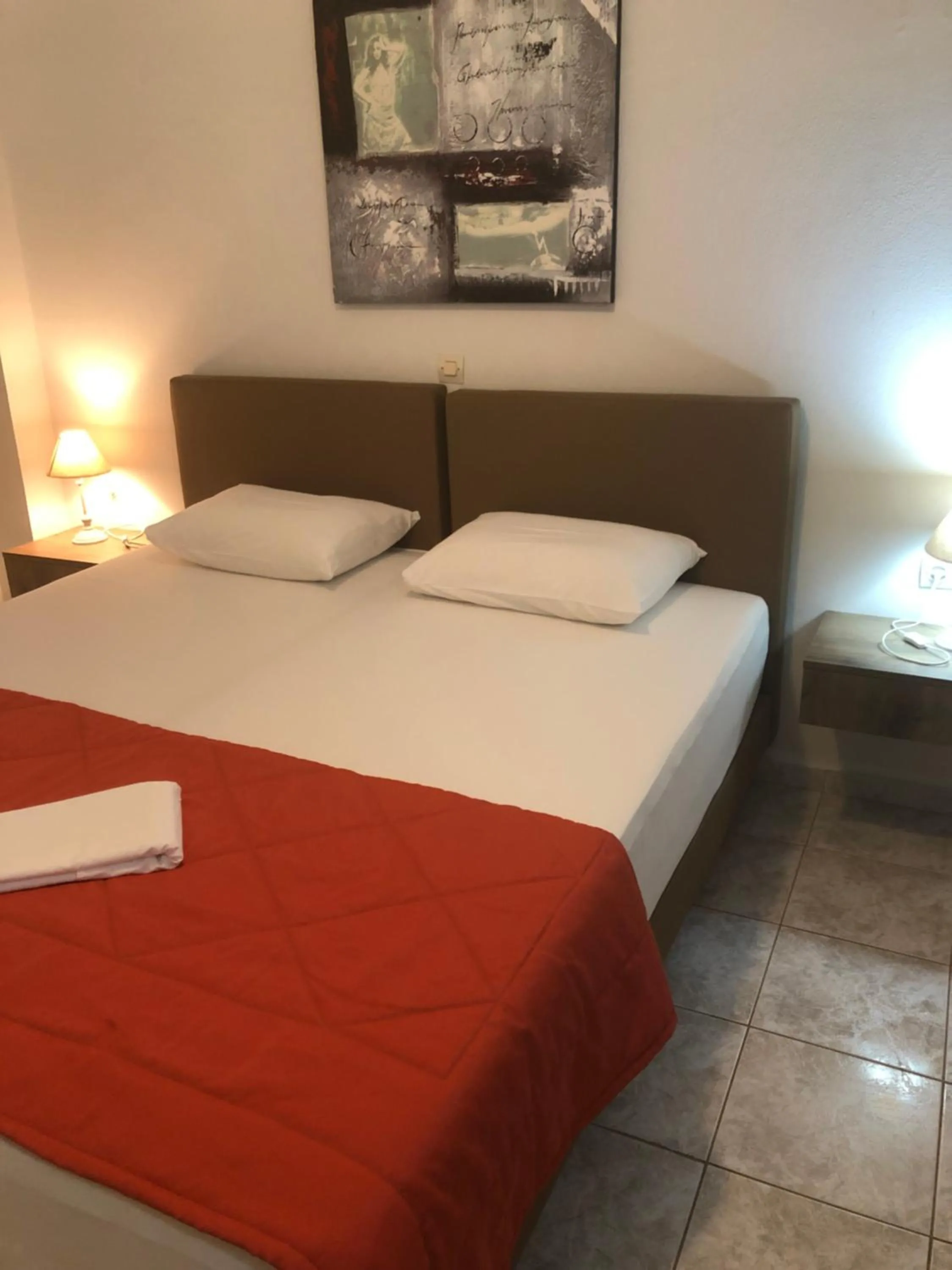 Bed in Chrisanthi Studios & Apartments