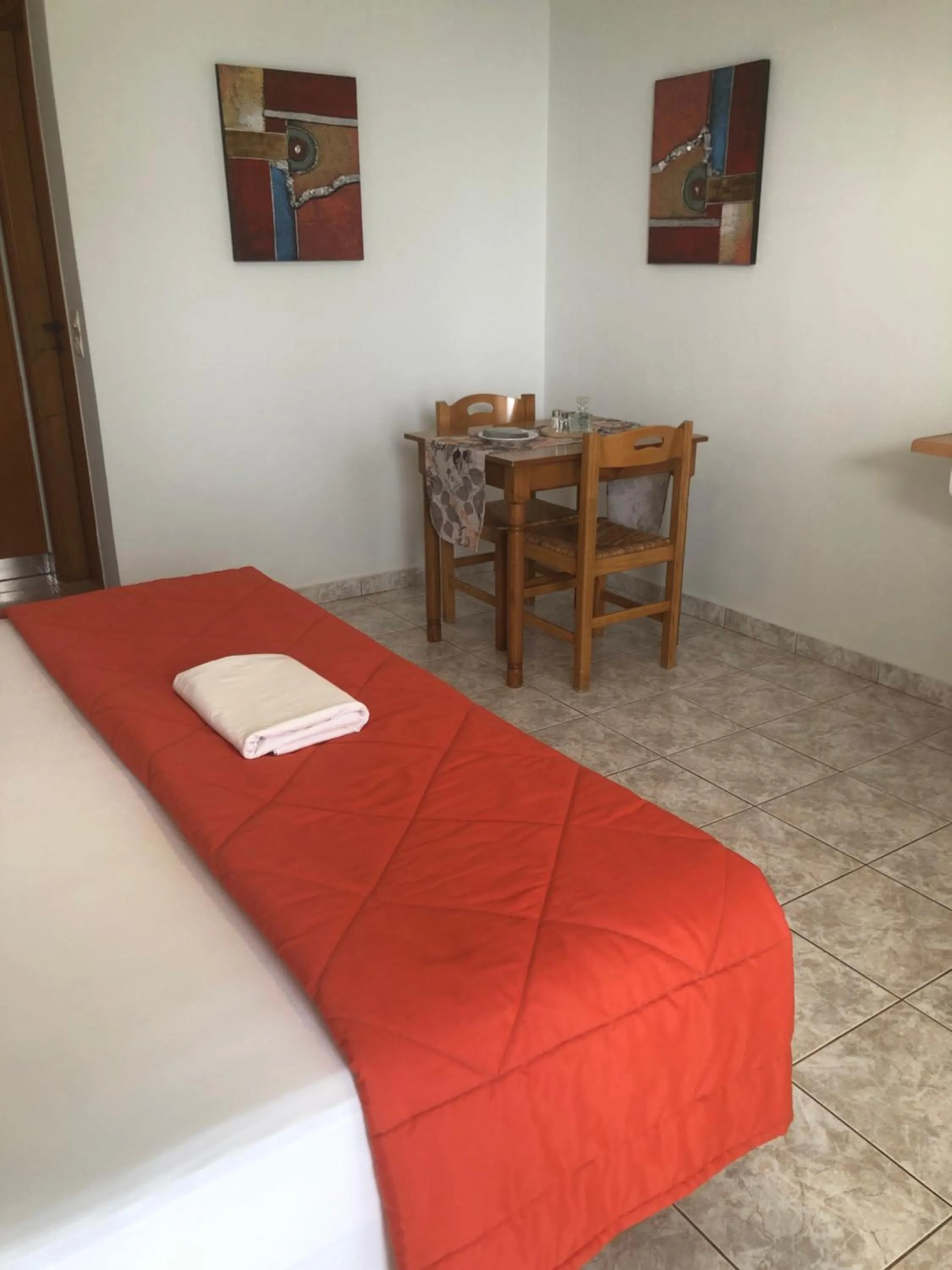 Dining area, Bed in Chrisanthi Studios & Apartments