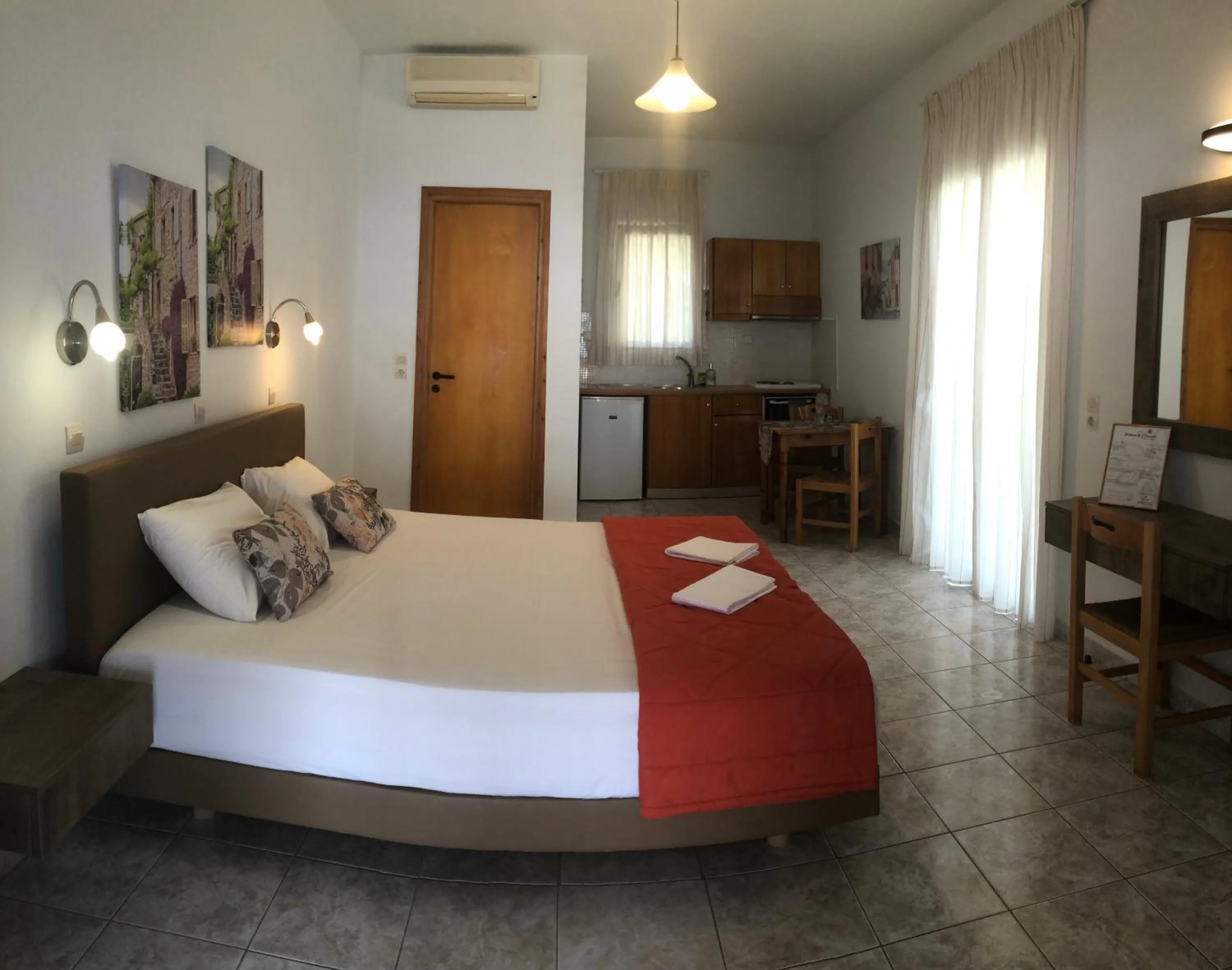Dining area, Bed in Chrisanthi Studios & Apartments