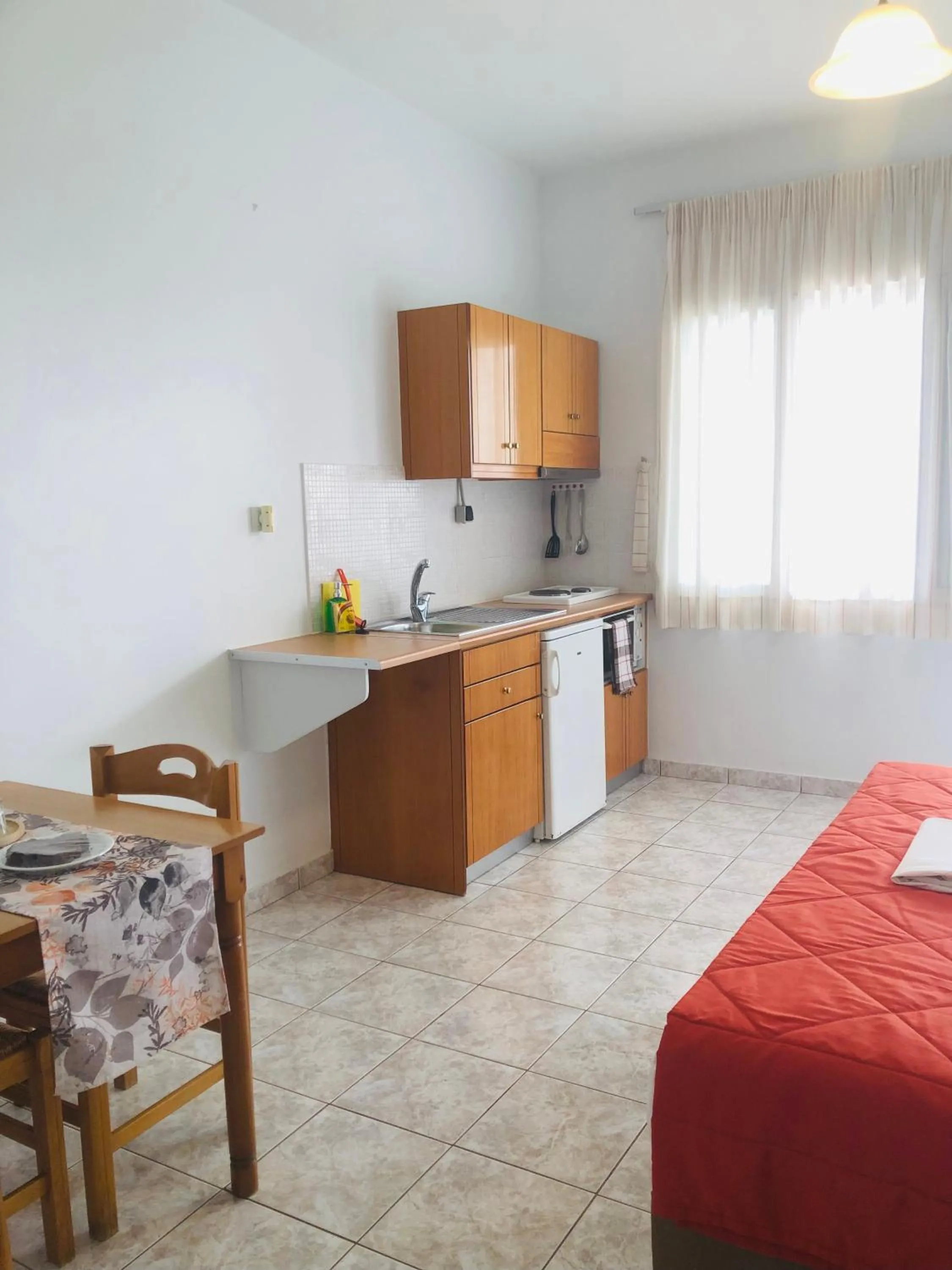 Bed in Chrisanthi Studios & Apartments