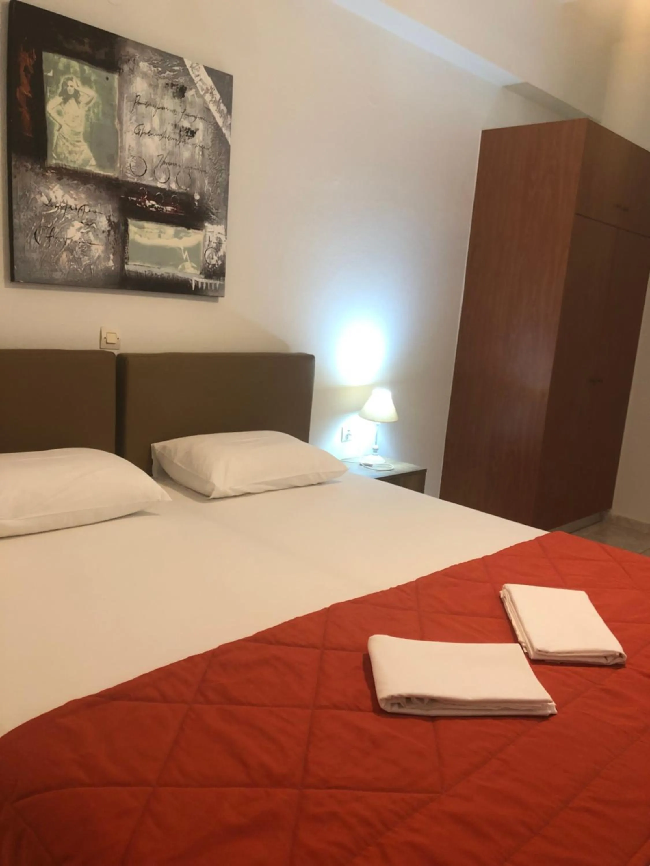 Bed in Chrisanthi Studios & Apartments