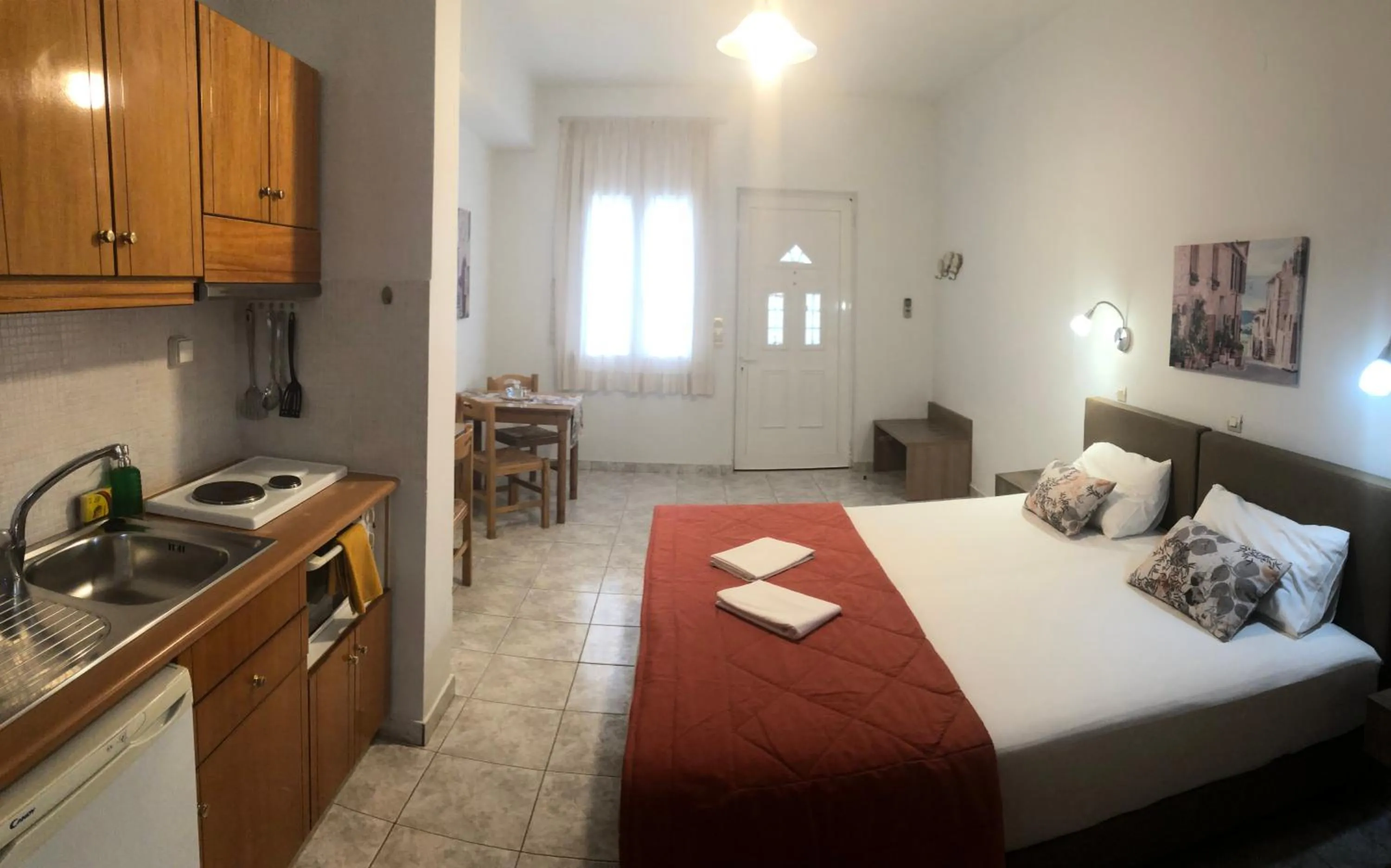 Dining area, Bed in Chrisanthi Studios & Apartments
