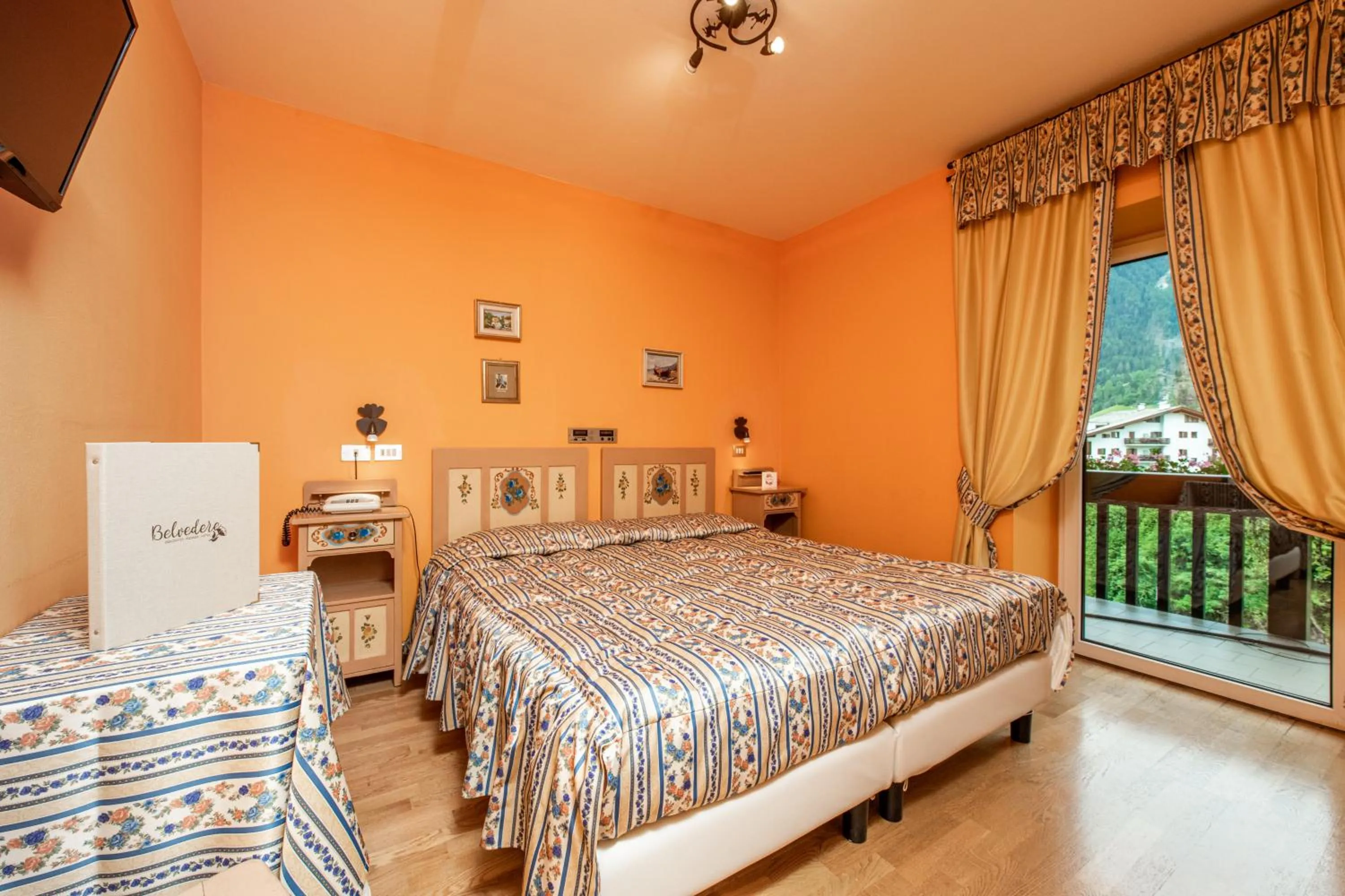 Bed in Belvedere Dolomites Flower Hotel