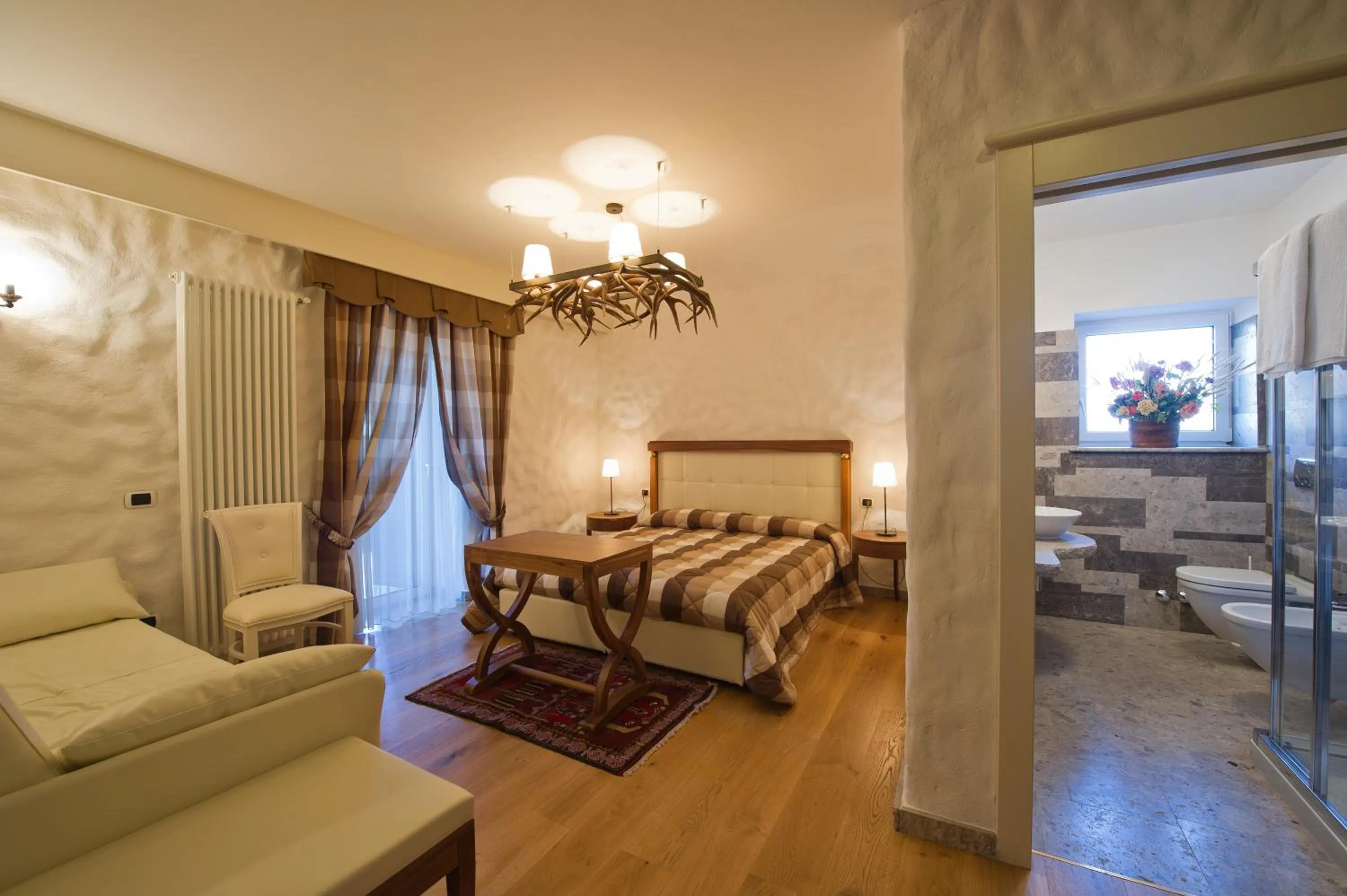 Bed in Belvedere Dolomites Flower Hotel