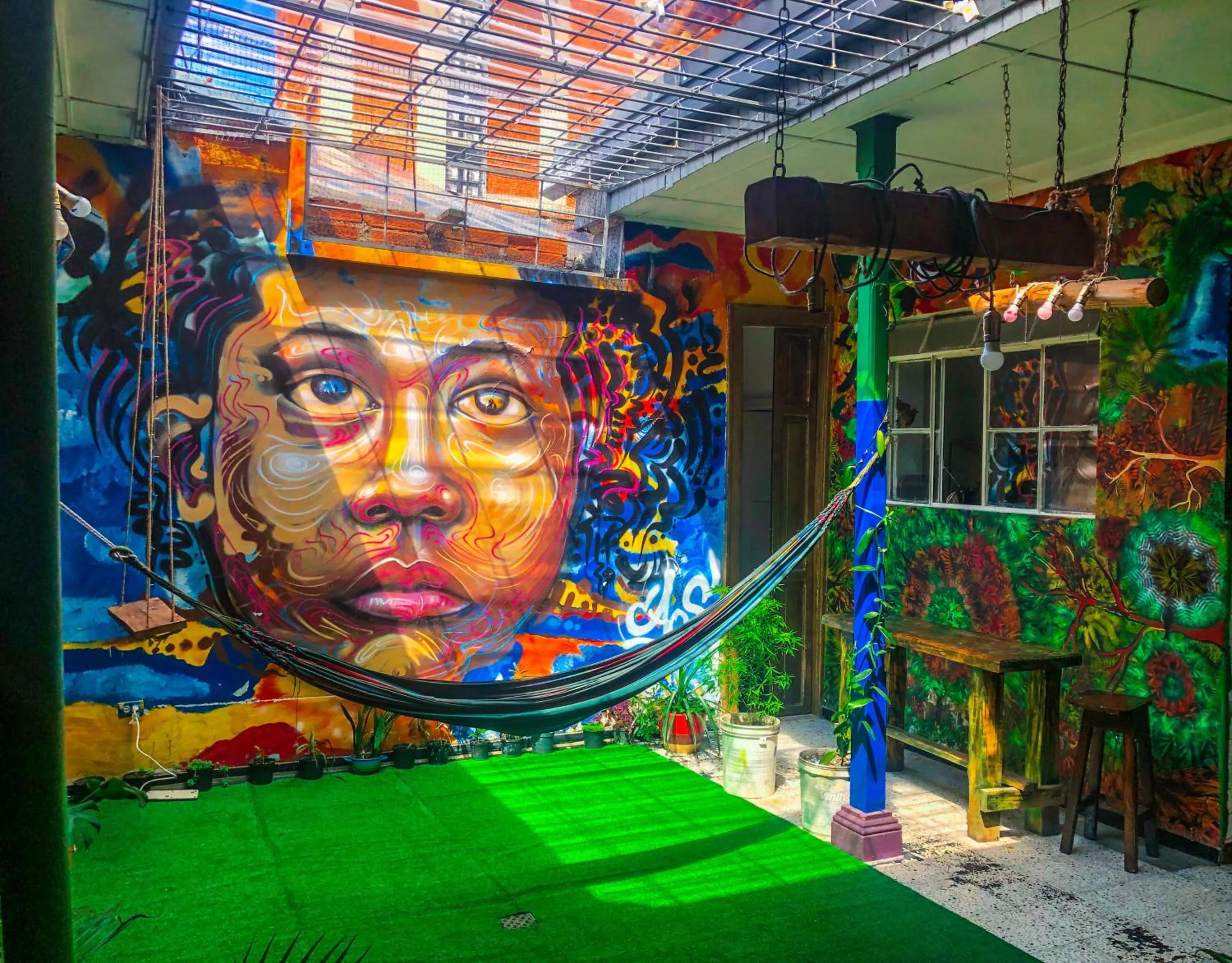 Communal lounge/ TV room in JEP Hostel