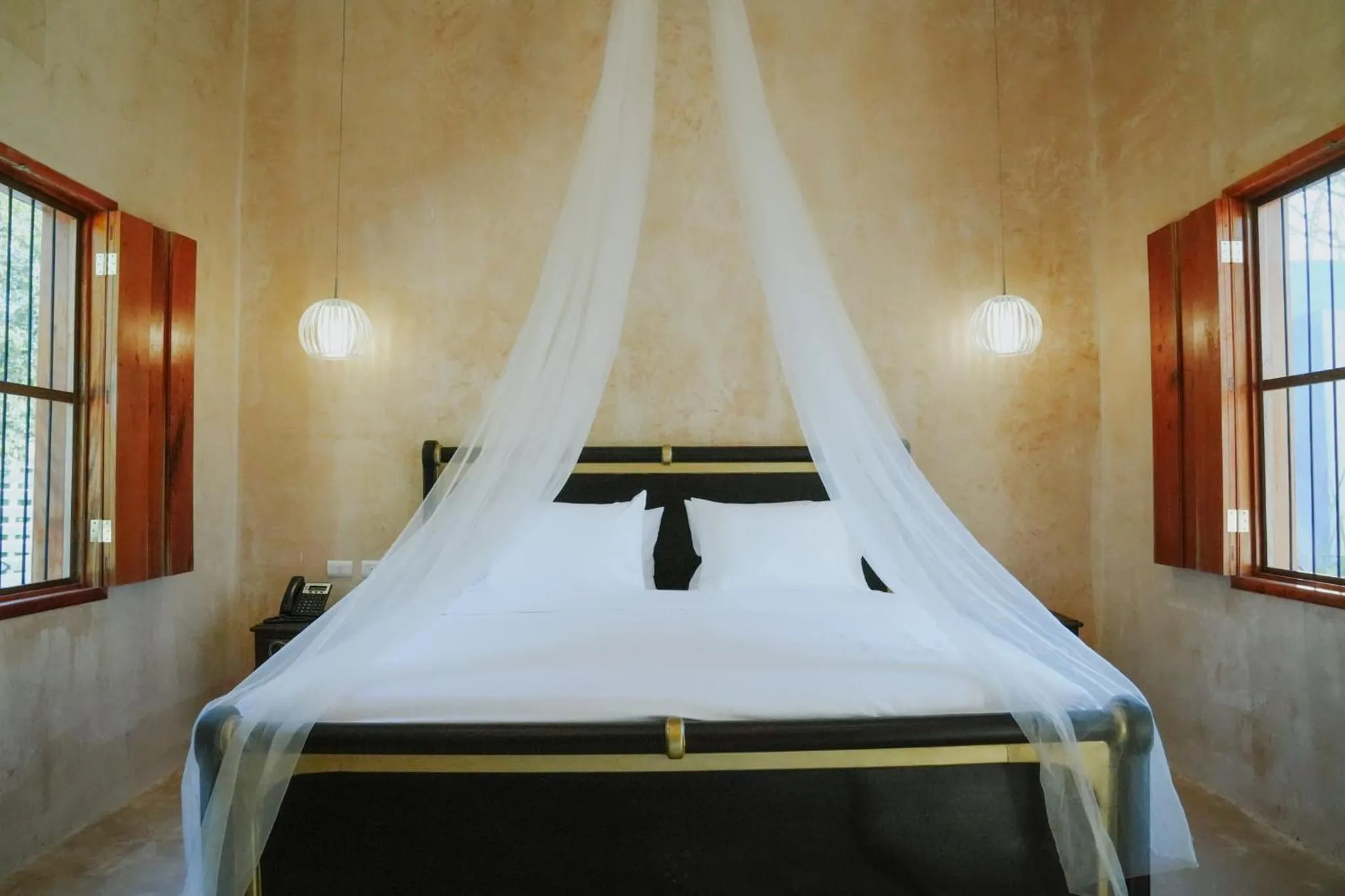 Bed in Hacienda Cenote San Ignacio