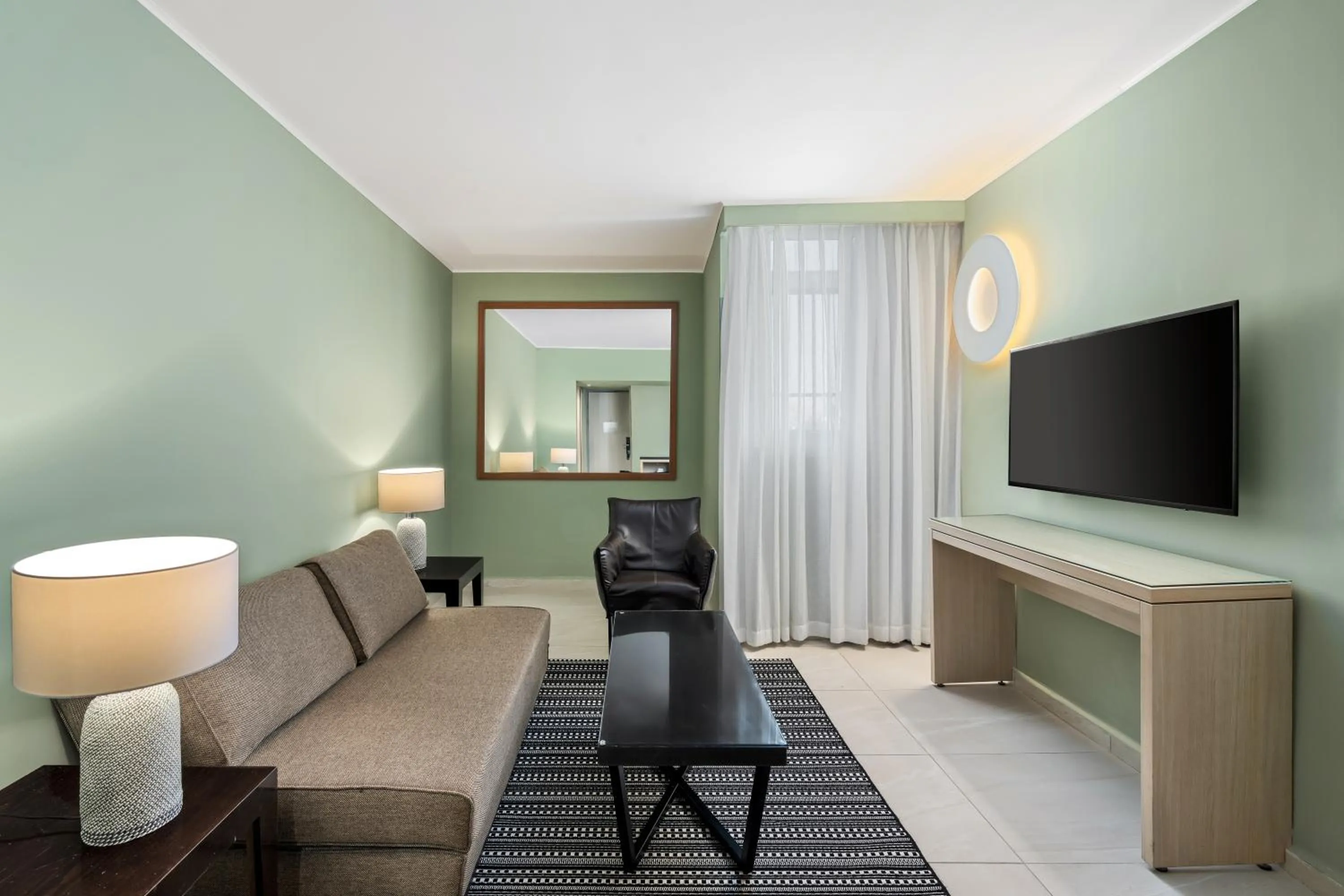 Living room in Sport Club by Isrotel Collection