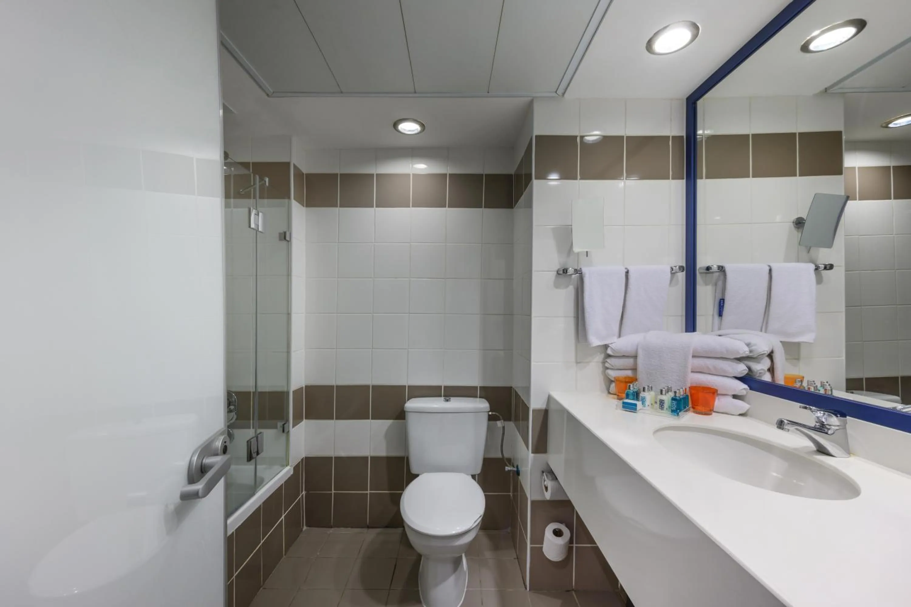 Bathroom in Sport Club by Isrotel Collection