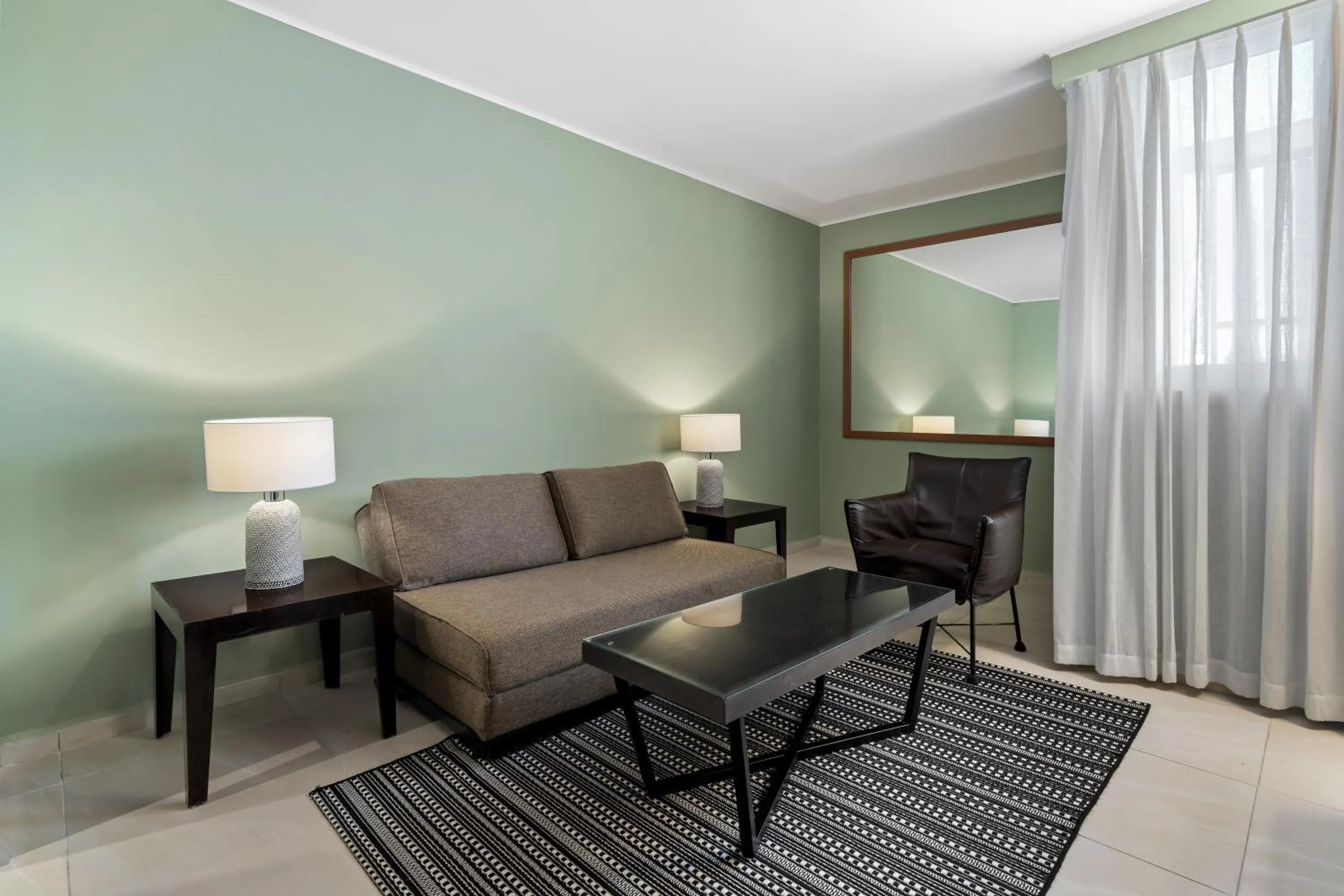 Living room in Sport Club by Isrotel Collection