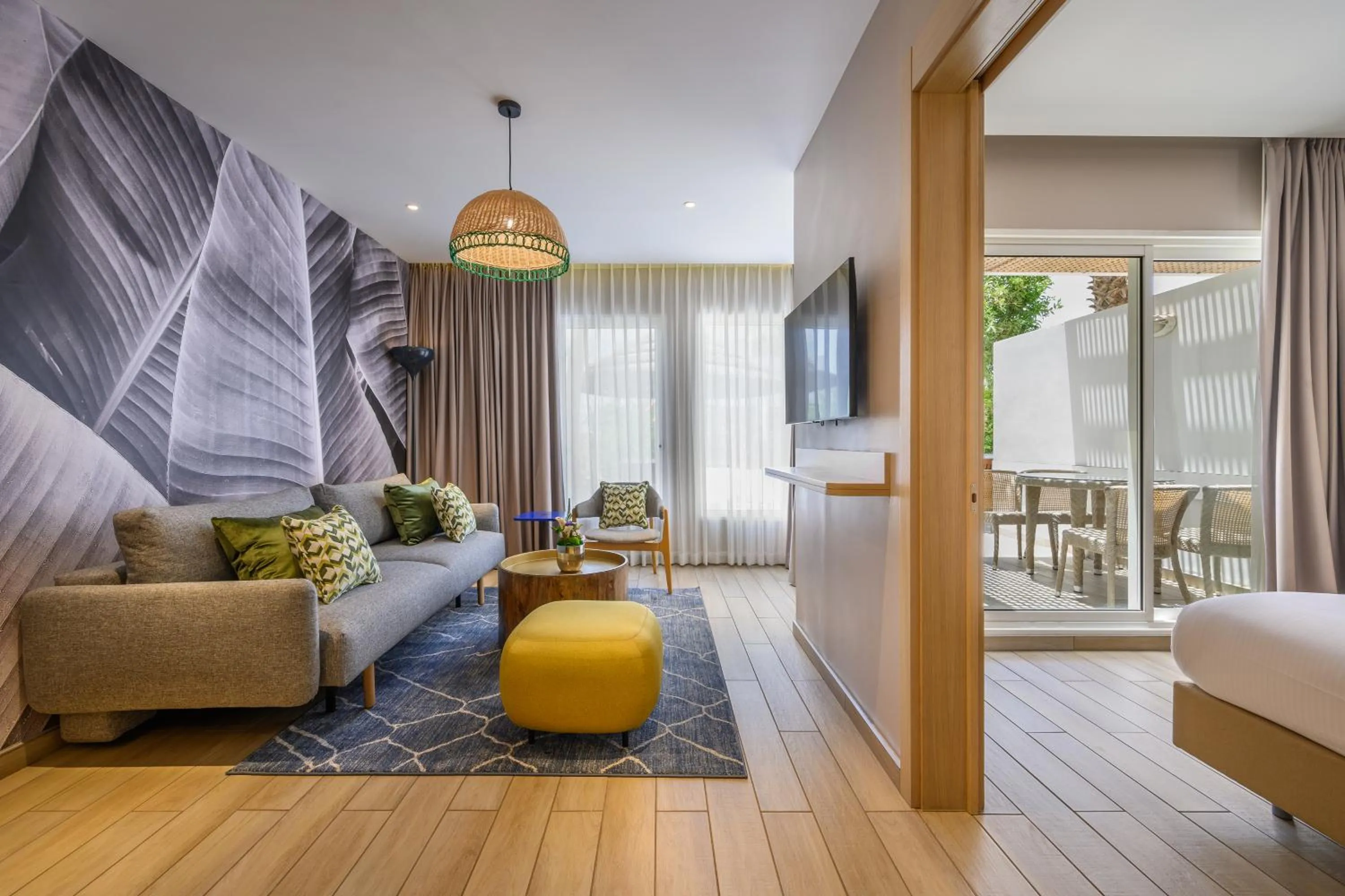 Living room, Bed in Royal Garden by Isrotel Collection