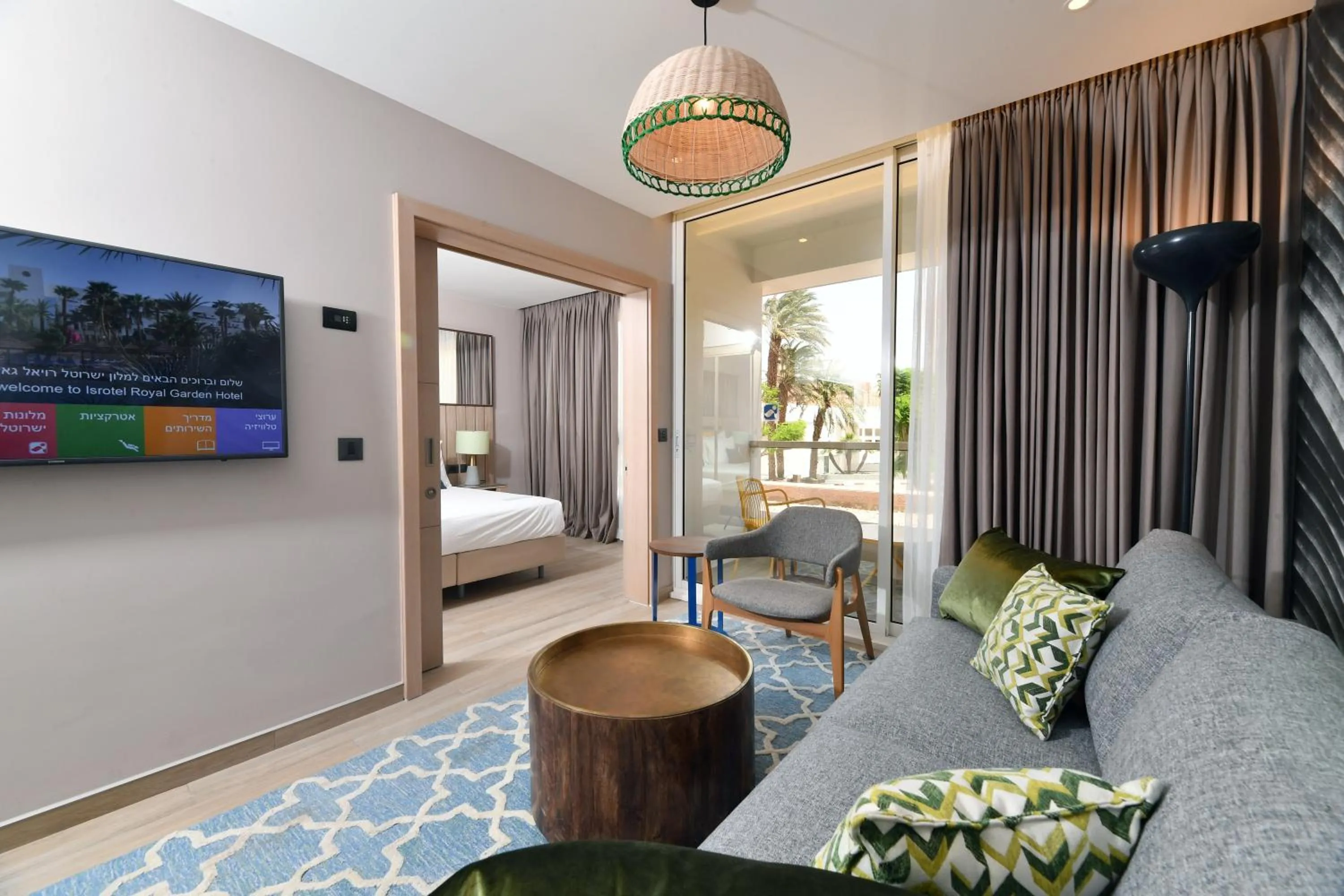 Living room, Bed in Royal Garden by Isrotel Collection