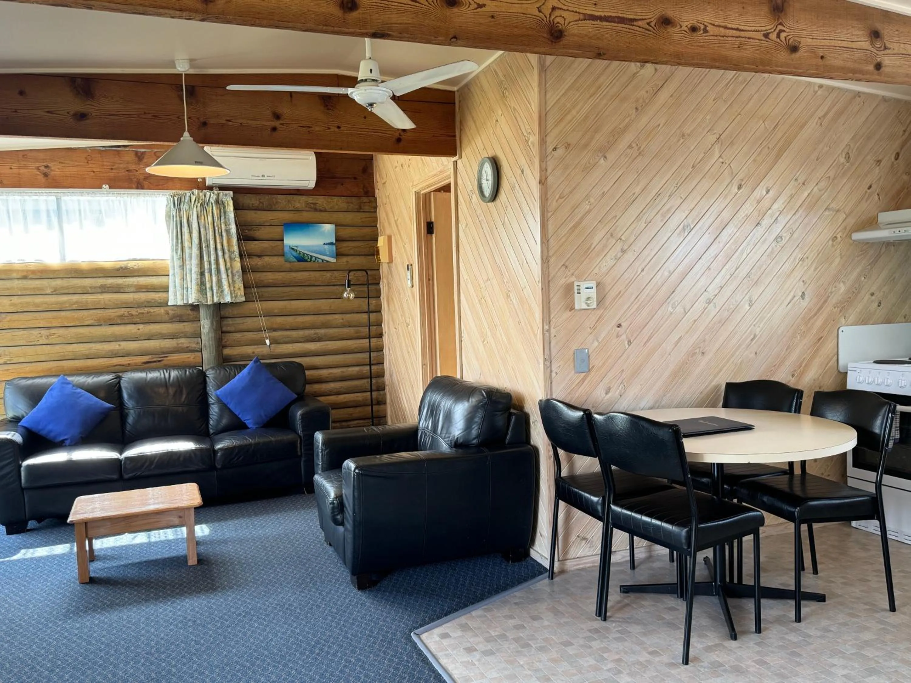 Seating area in Lazy Acre Log Cabins