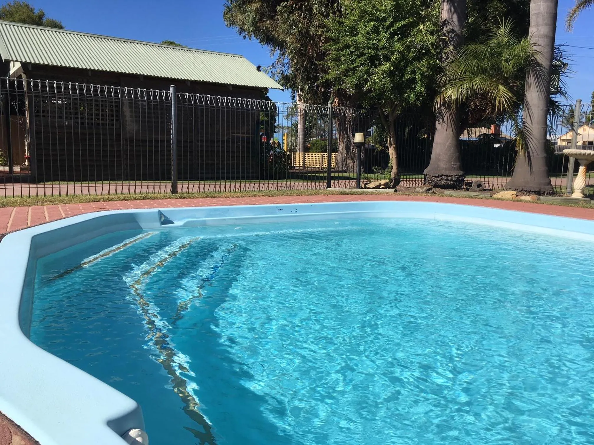 Swimming pool in Lazy Acre Log Cabins