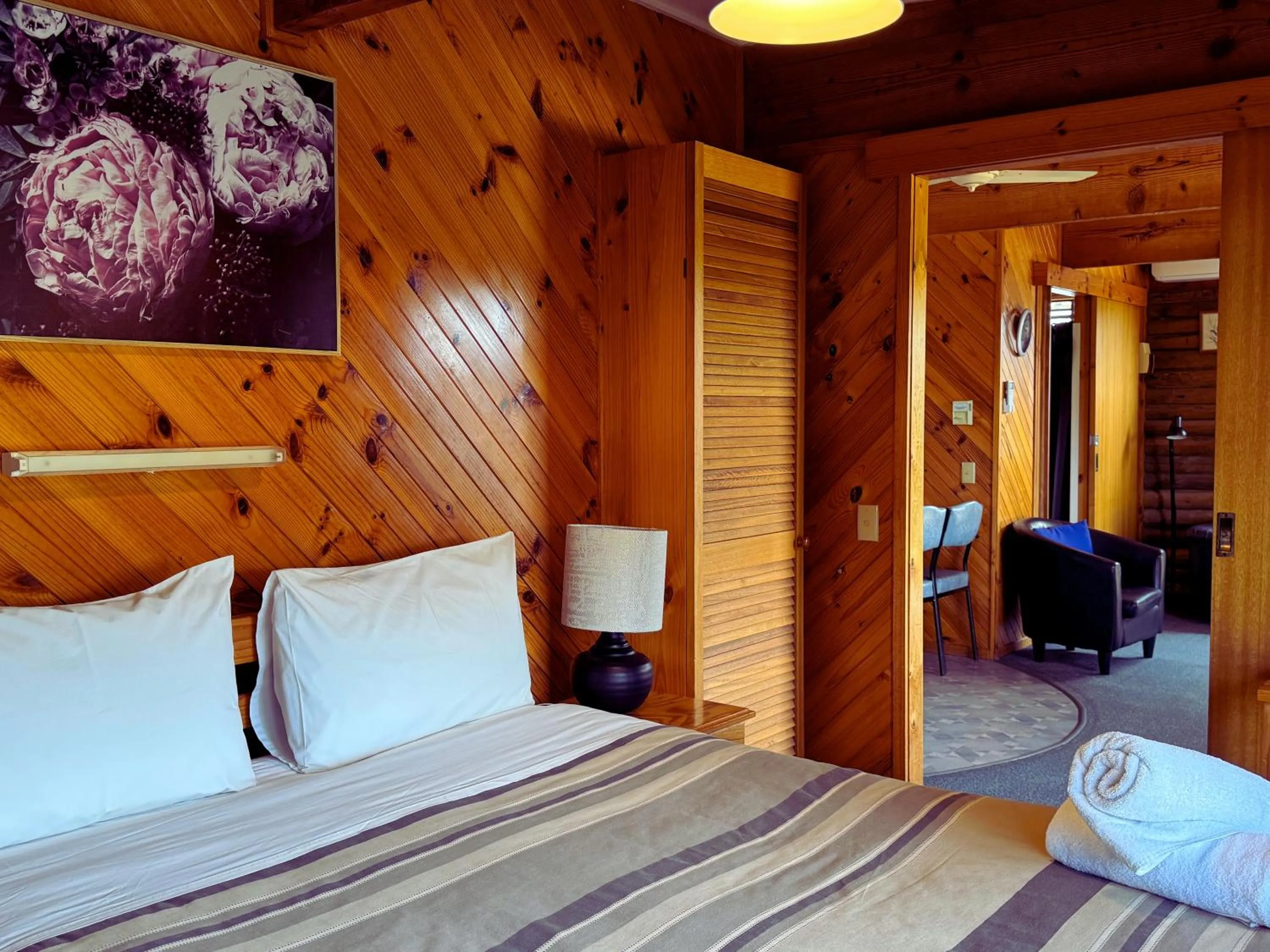 Bed in Lazy Acre Log Cabins