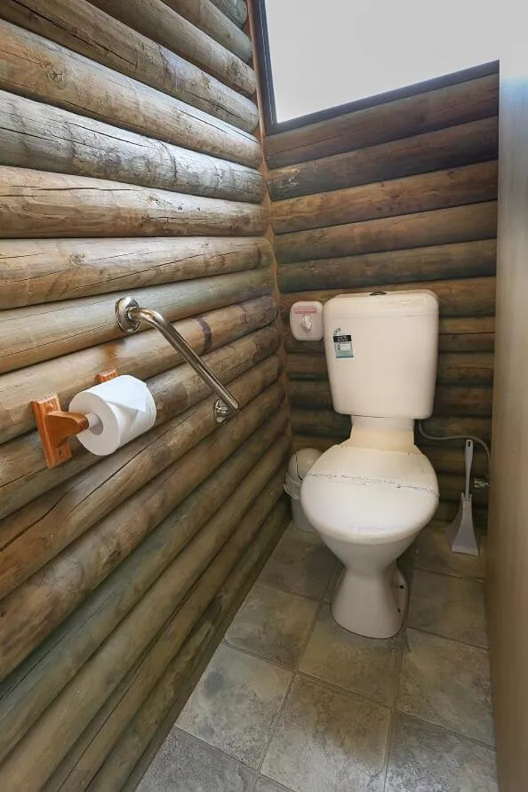 Toilet in Lazy Acre Log Cabins