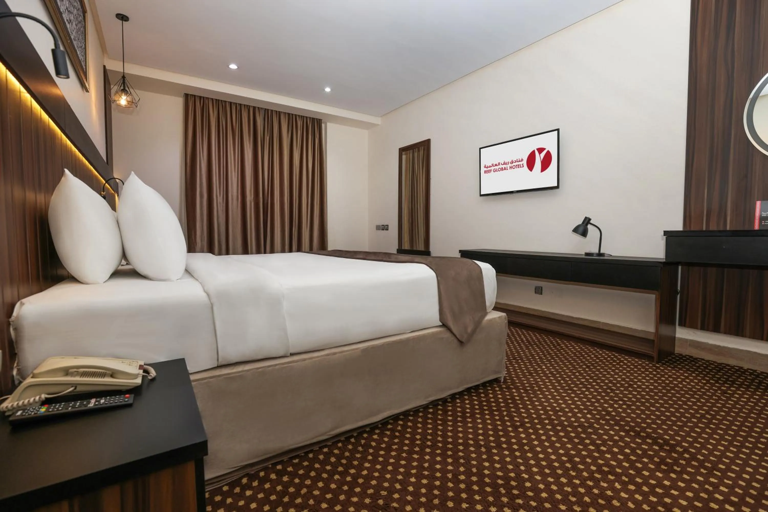 Bed in Reef Global Hotel