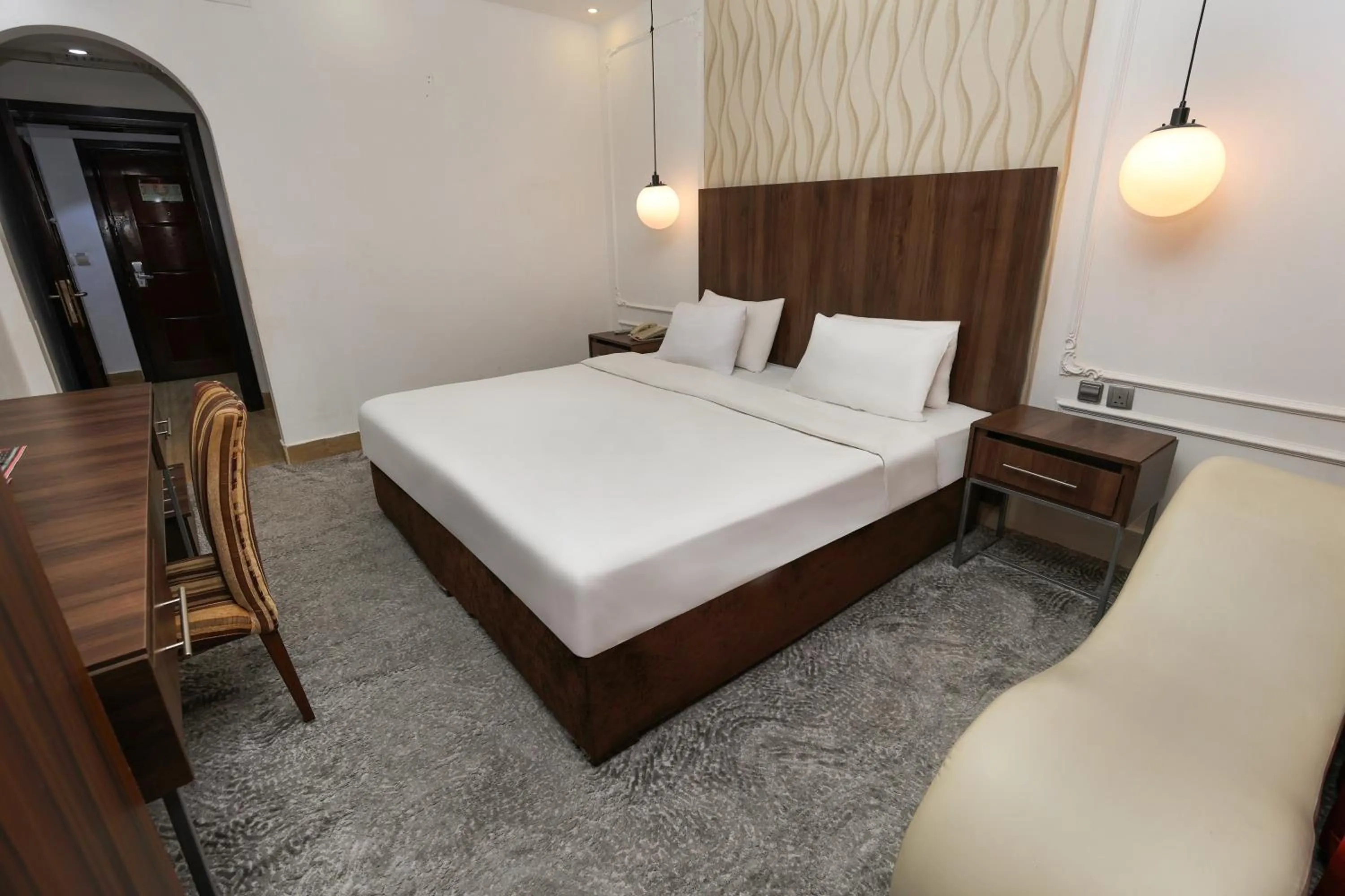 Bedroom in Reef Global Hotel