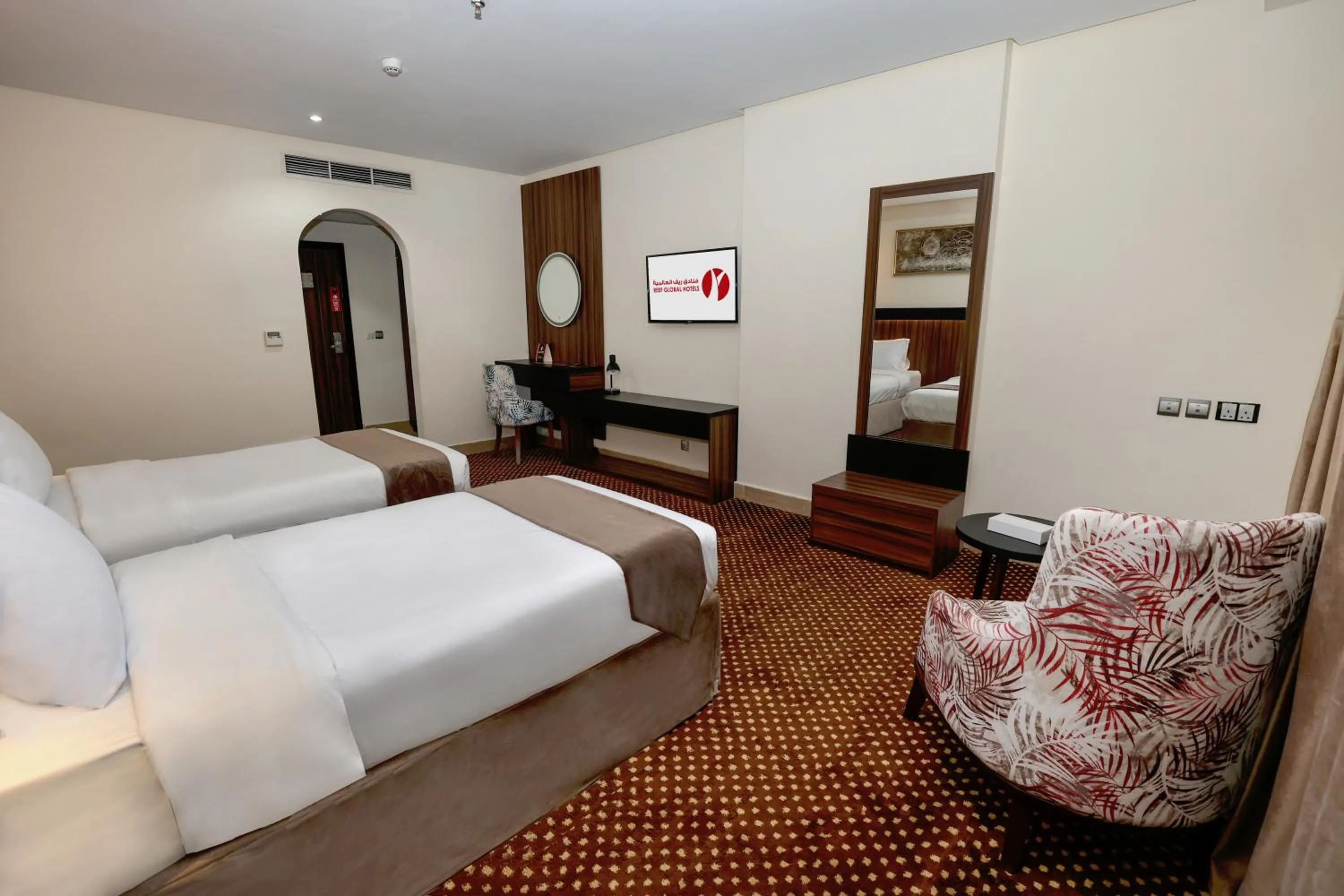 Bed in Reef Global Hotel