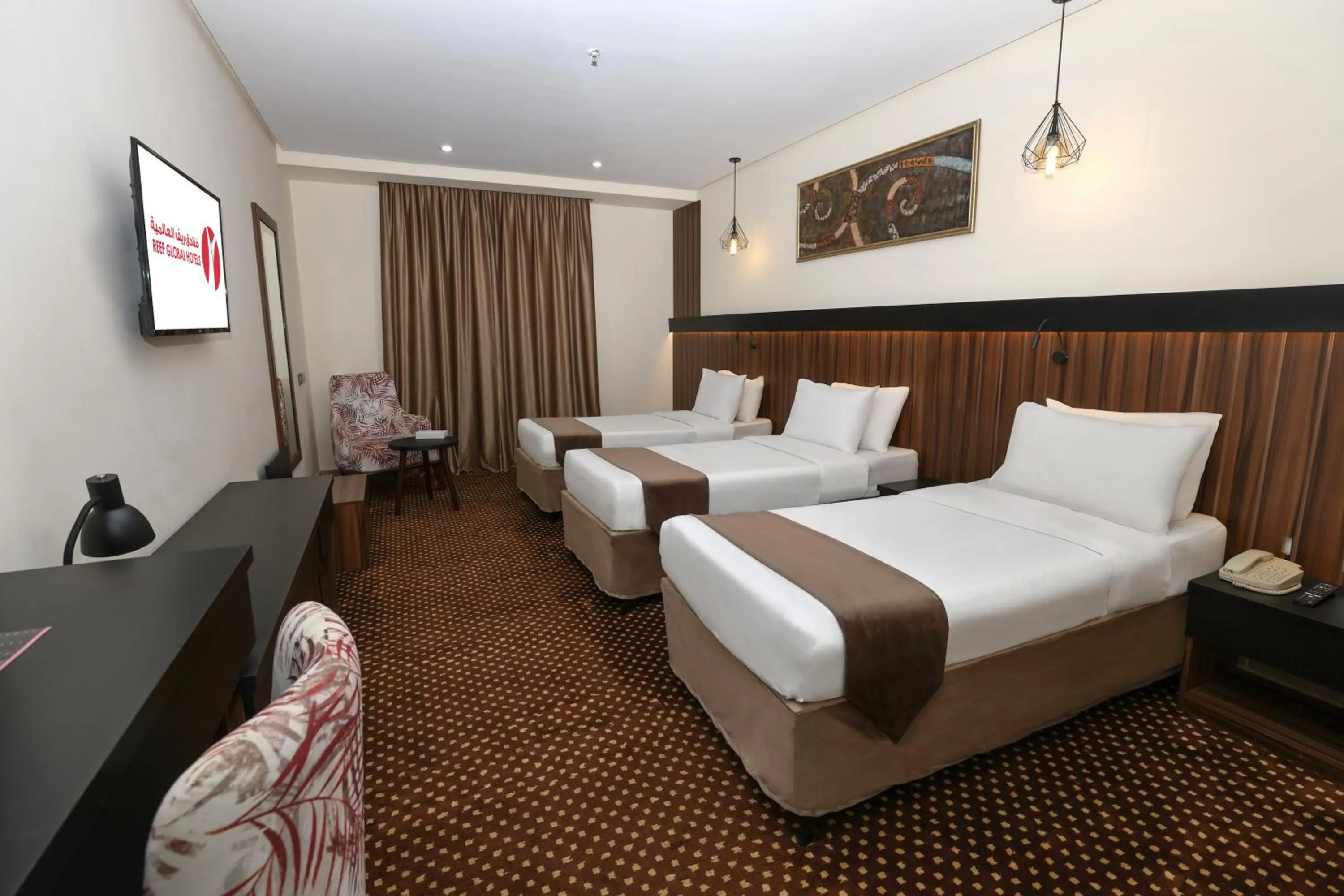 Bed in Reef Global Hotel