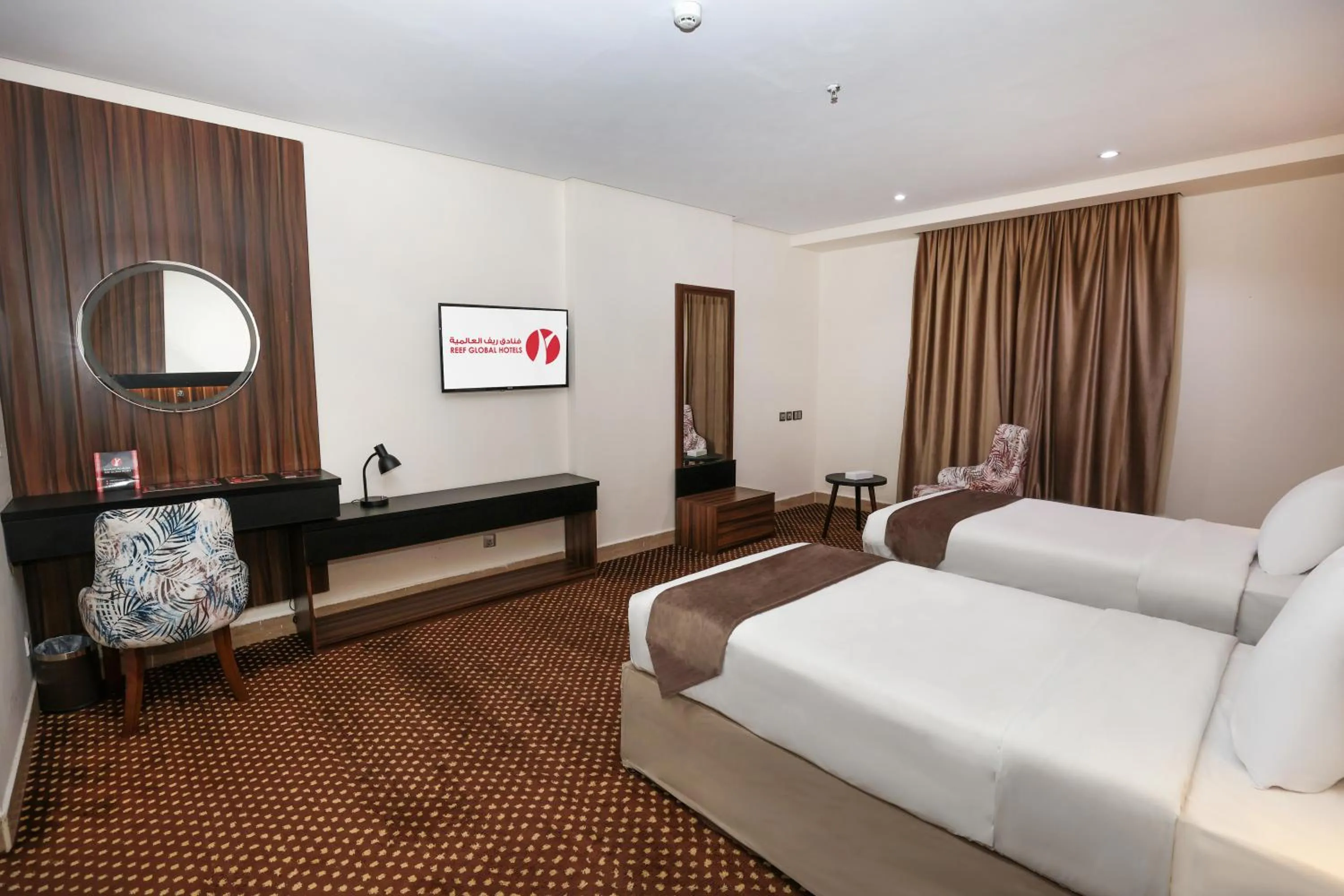 Bed in Reef Global Hotel