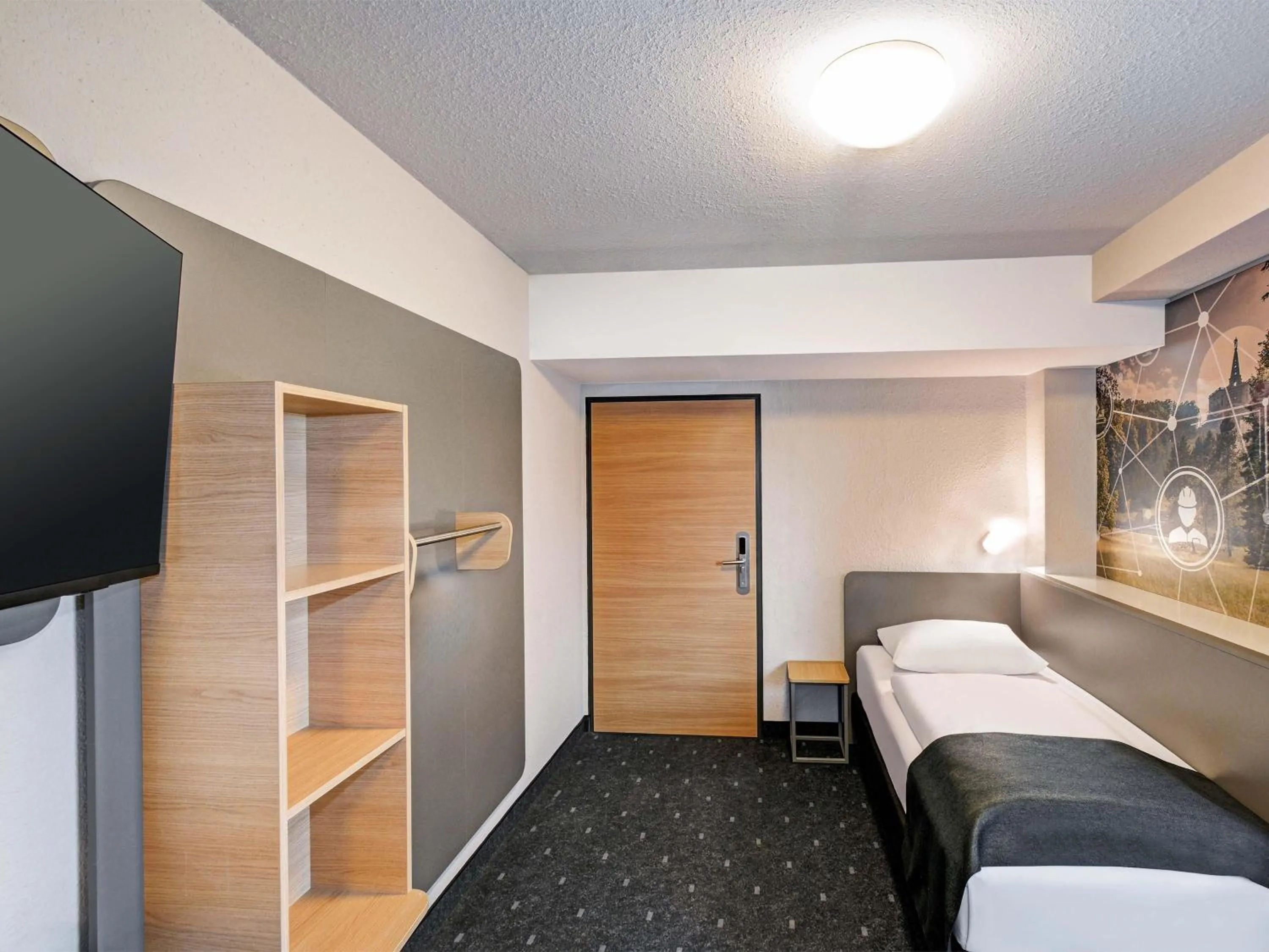 Photo of the whole room, Bed in B&B HOTEL Kassel-Industriepark