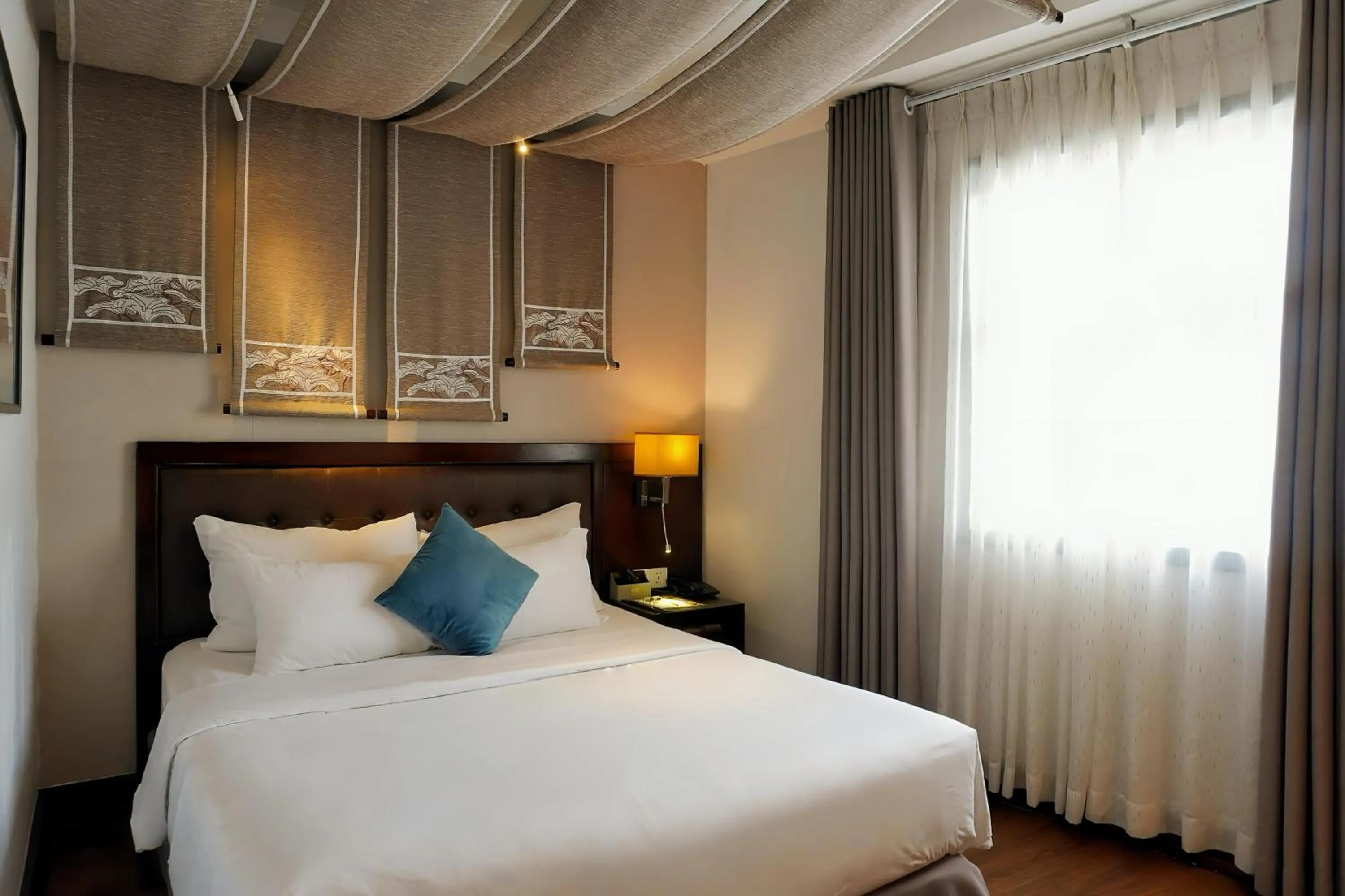 Bed in The Odys Boutique Hotel