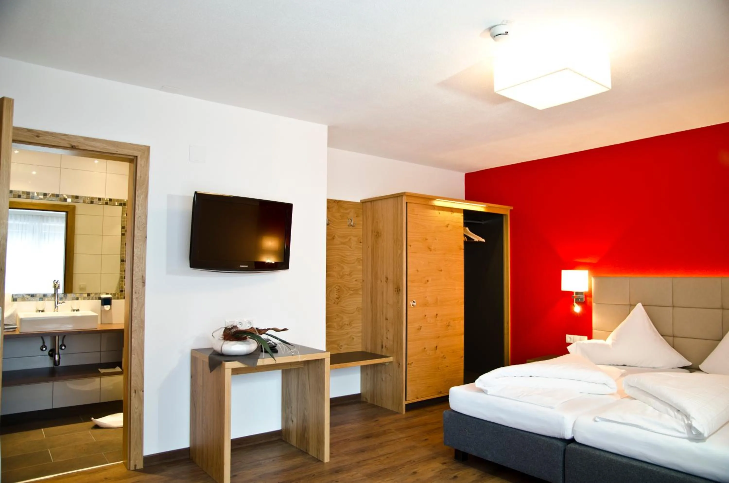 Bedroom in Hotel Garni Alpenland