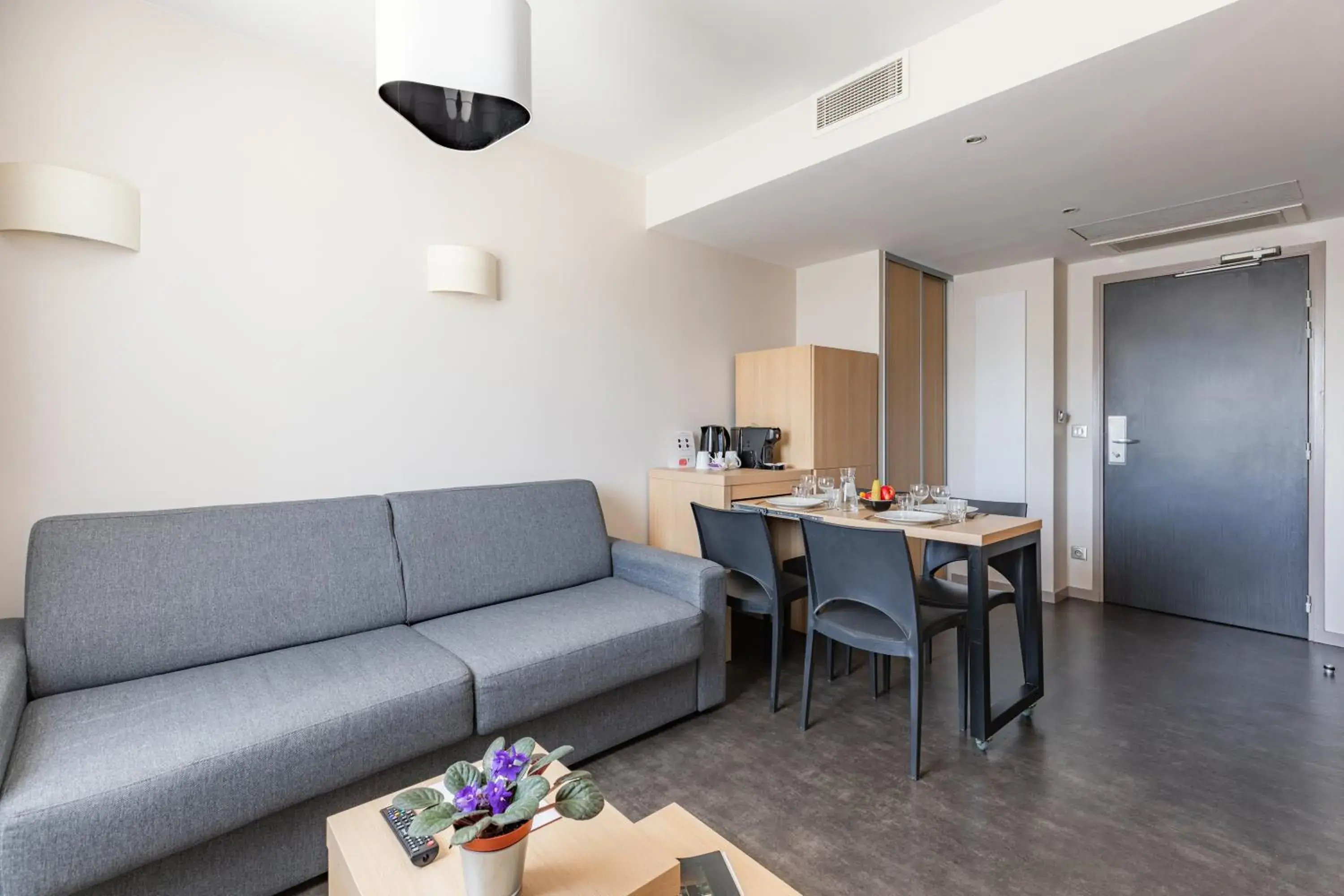 Living room in Appart’City Confort Lyon Cité Internationale Living room in Appart’City Confort Lyon Cité Internationale
