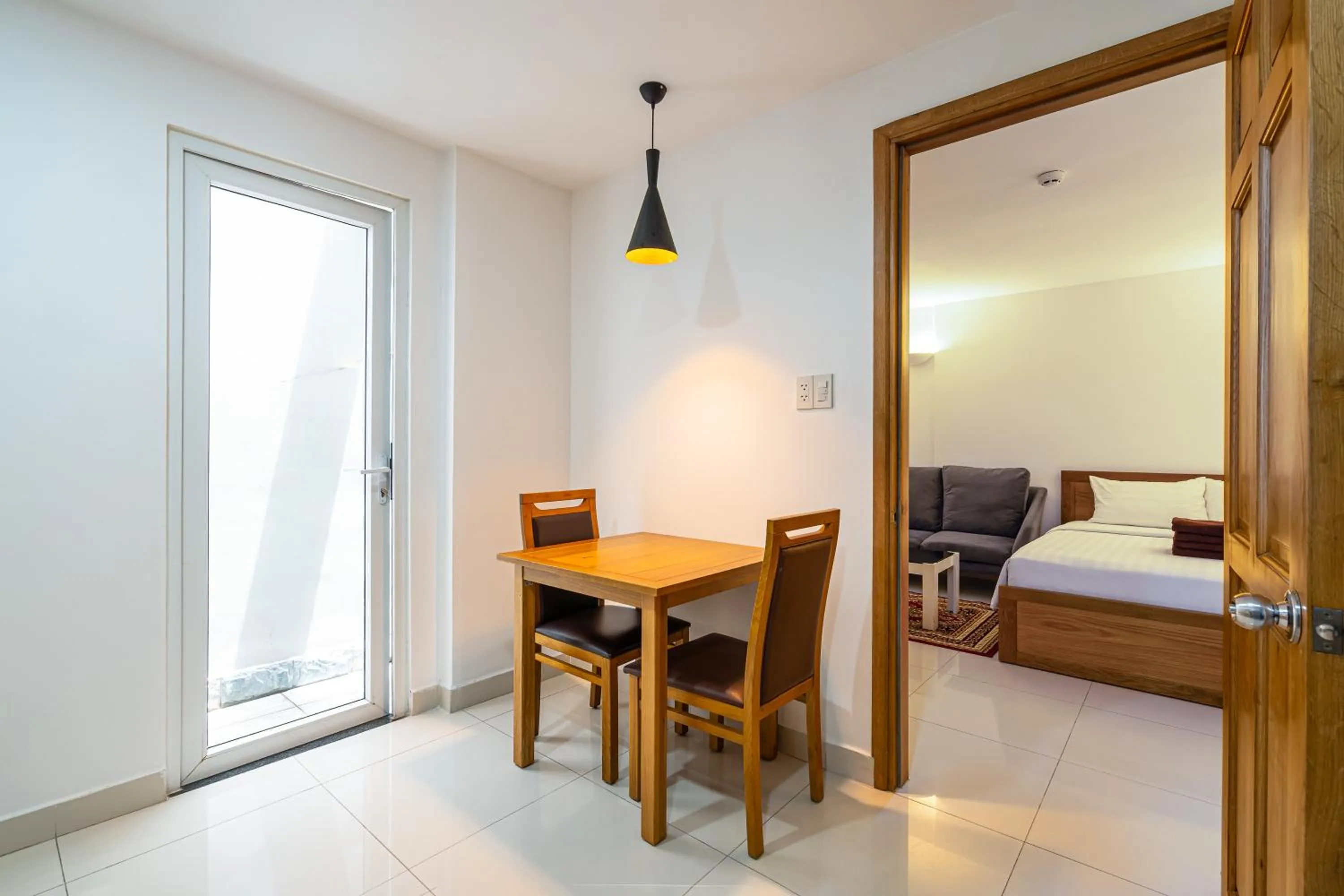 Dining area, Bed in SaigonOne Serviced Apartment