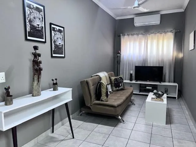 Communal lounge/ TV room in Turaco Lodge - No Loadshedding