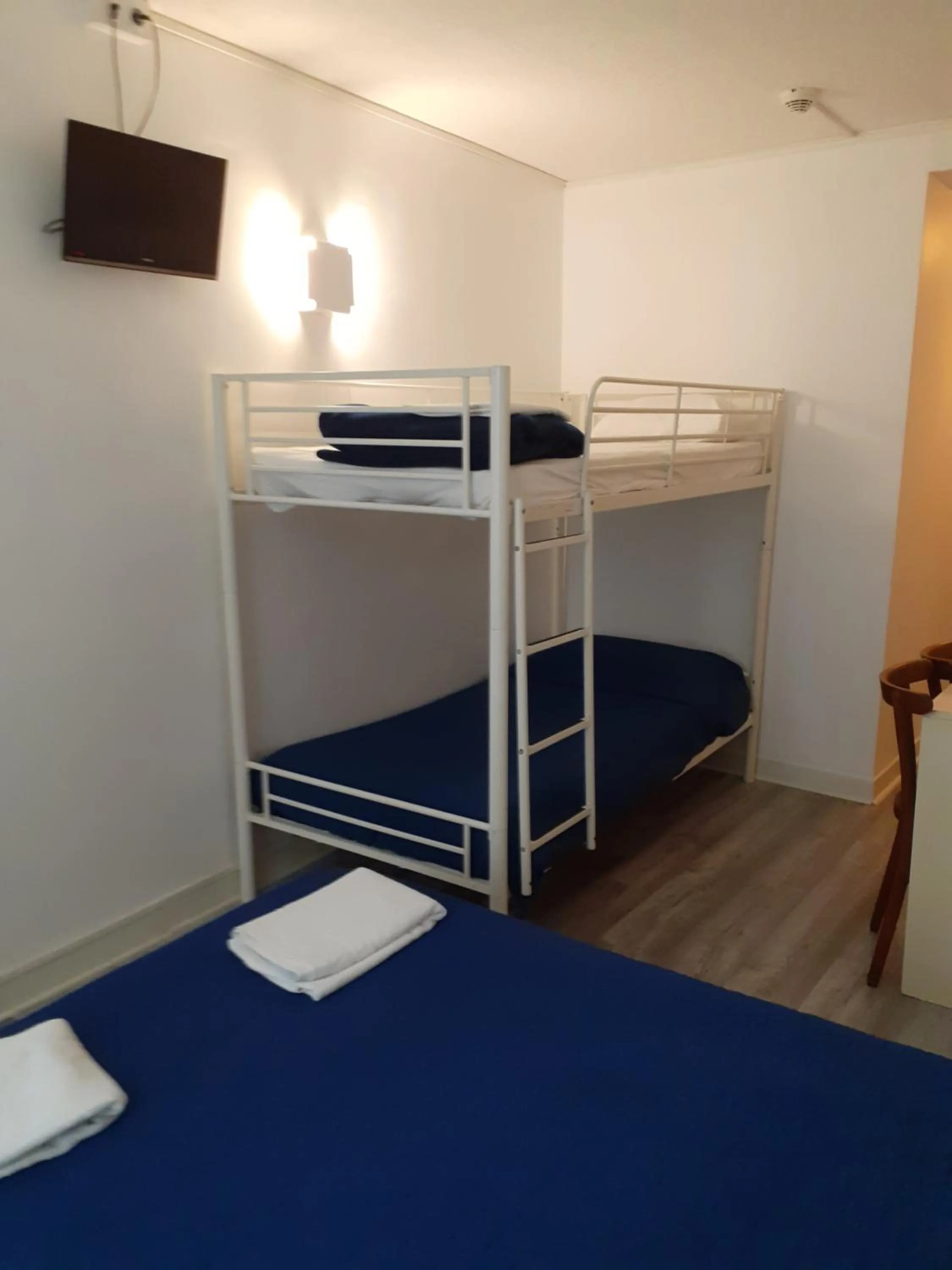 Bed in Hôtel Croix des Nordistes