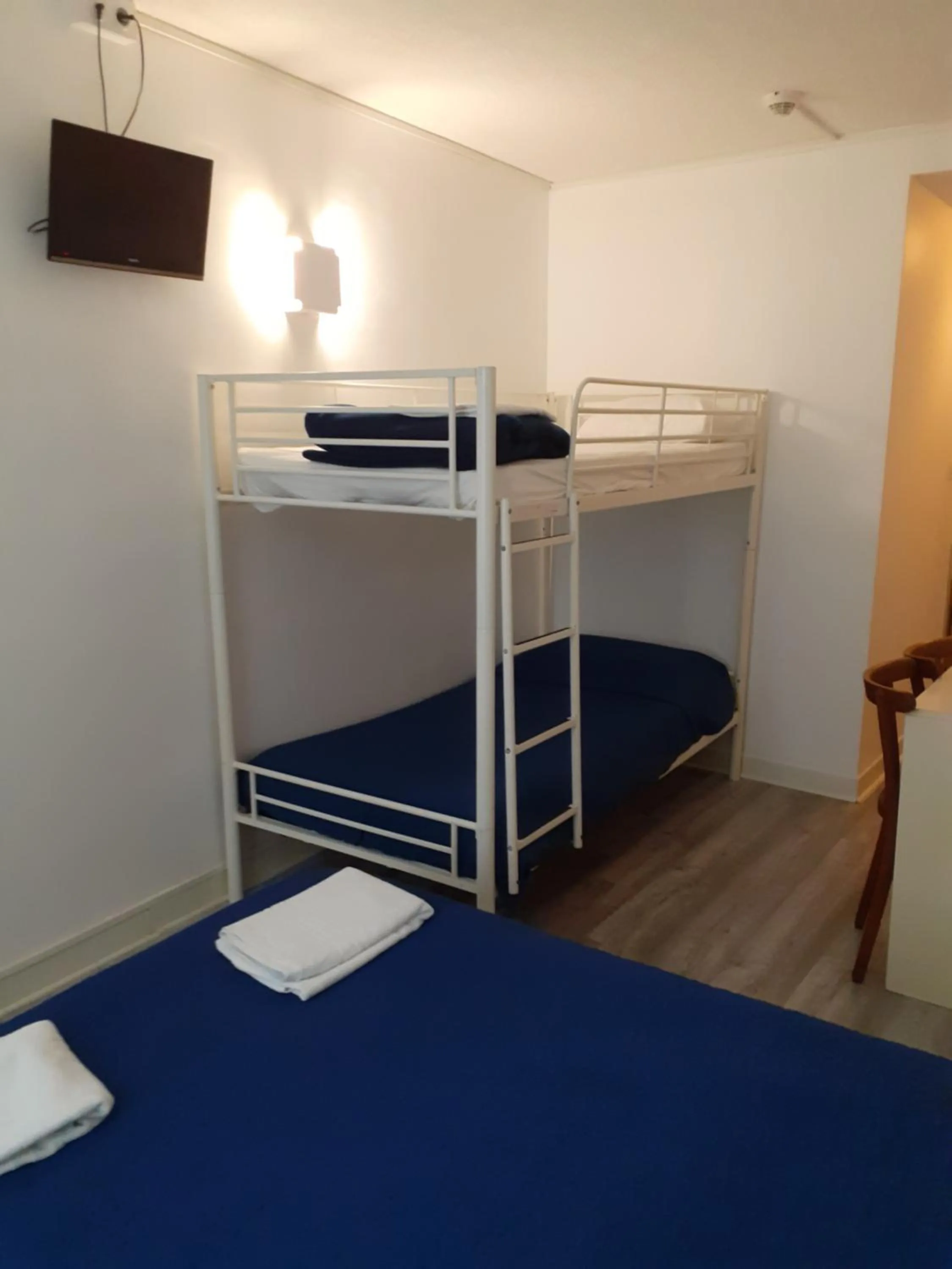 Bed in Hôtel Croix des Nordistes