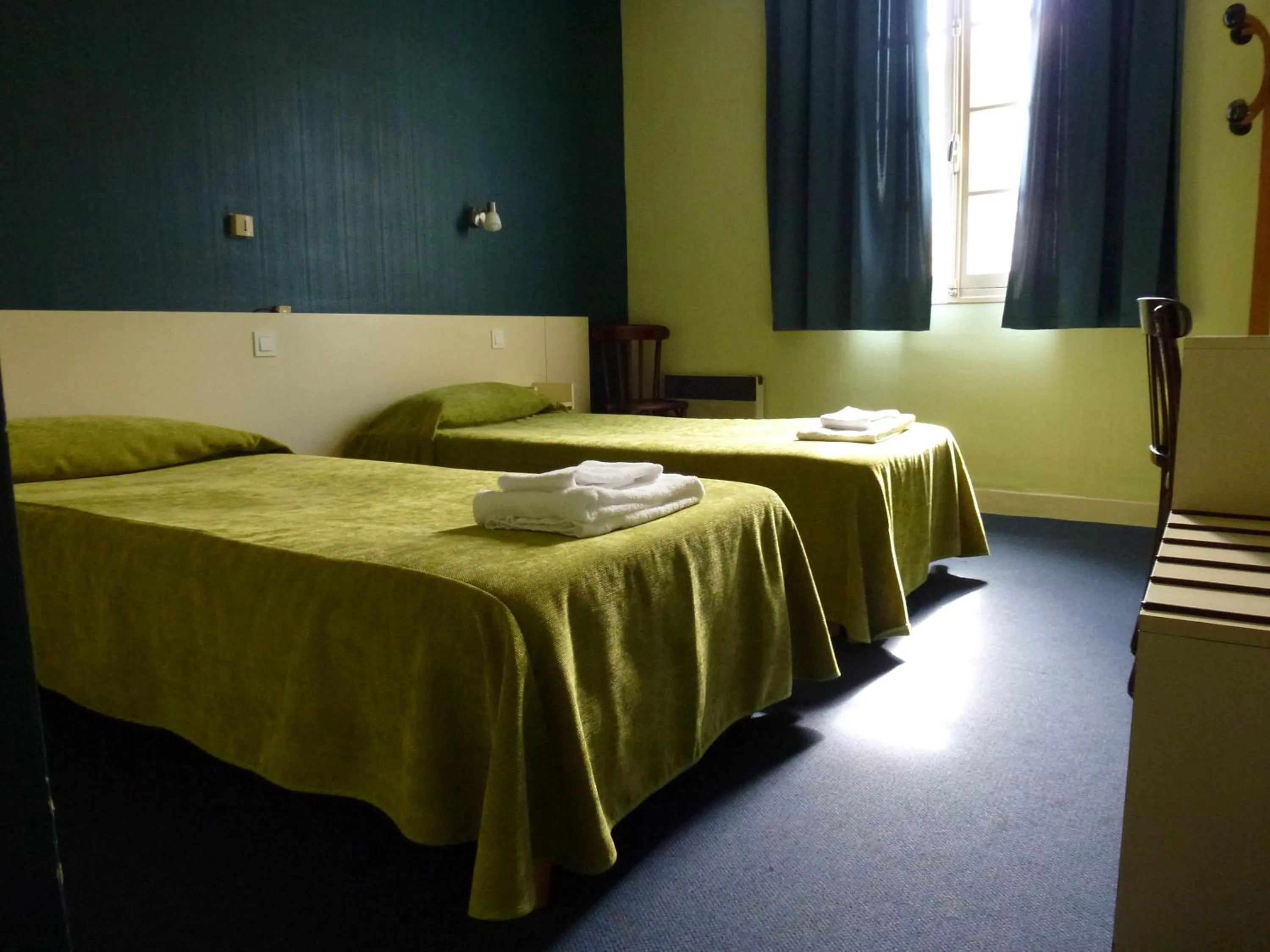 Bed in Hôtel Croix des Nordistes