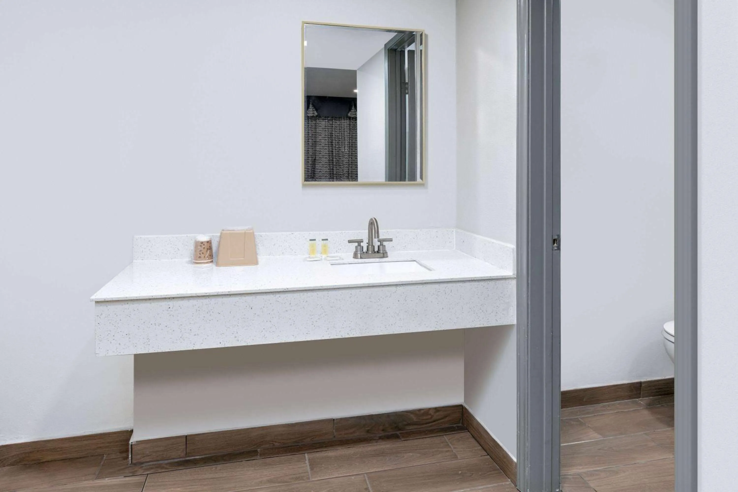 Bathroom in Days Inn by Wyndham South Fort Worth