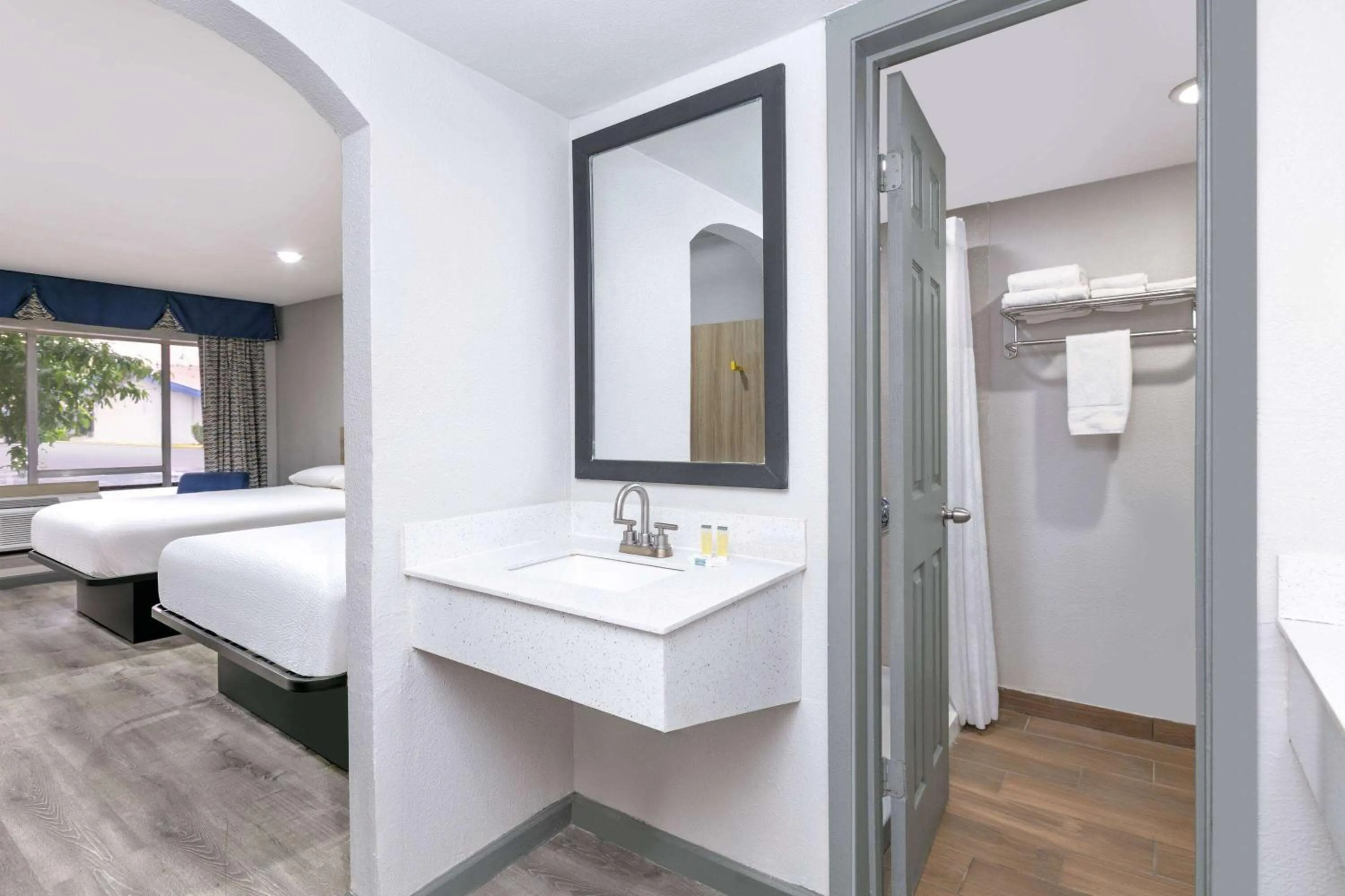 Bathroom, Bed in Days Inn by Wyndham South Fort Worth