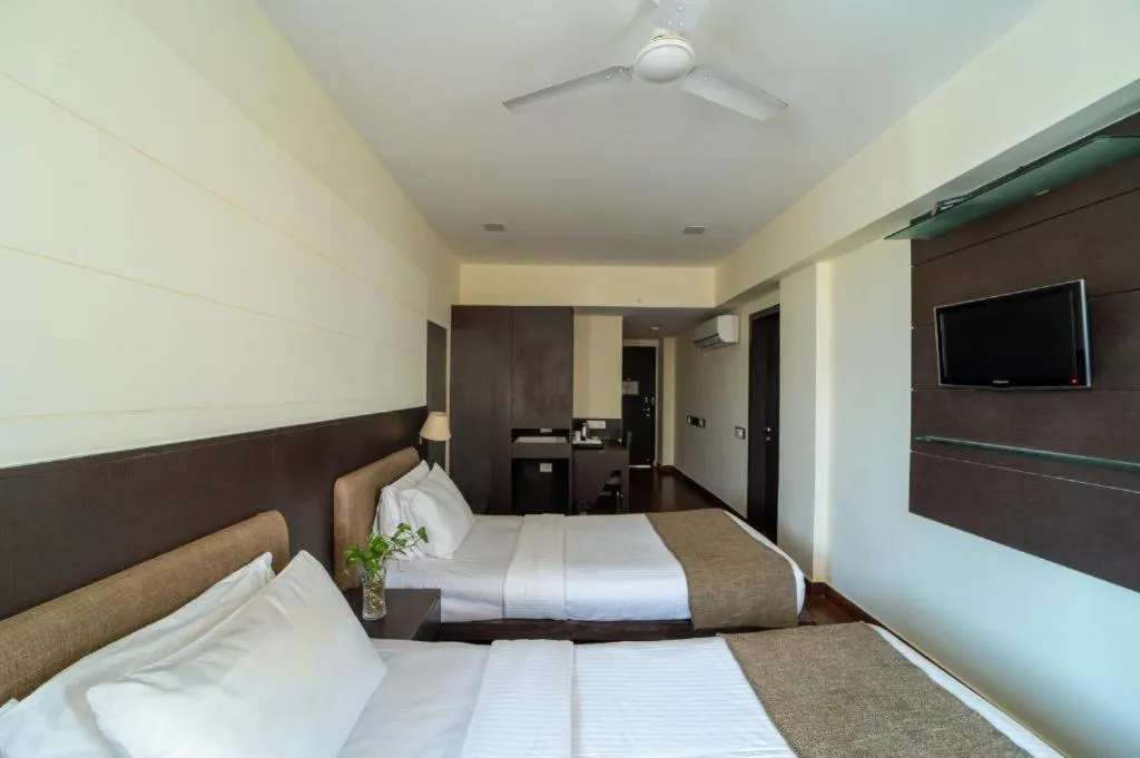 Bed in Whispering Palms Hotel Jaipur