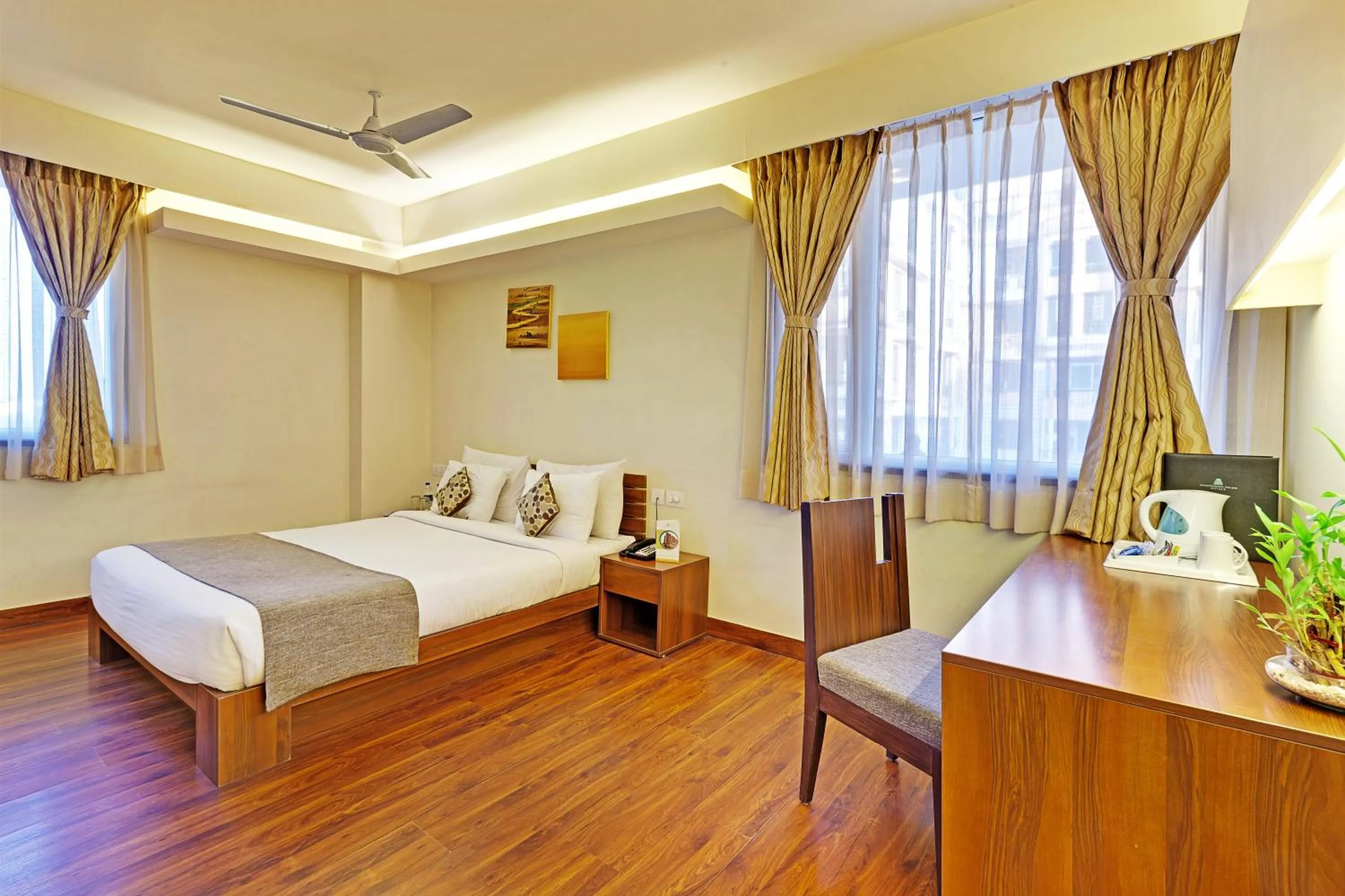 Bed in Whispering Palms Hotel Jaipur