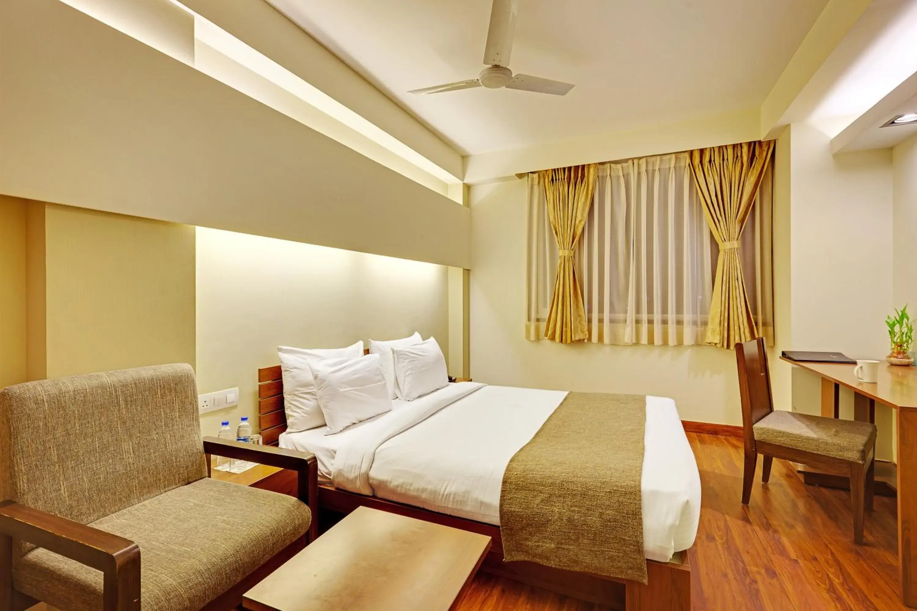 Seating area, Bed in Whispering Palms Hotel Jaipur Seating area, Bed in Whispering Palms Hotel Jaipur
