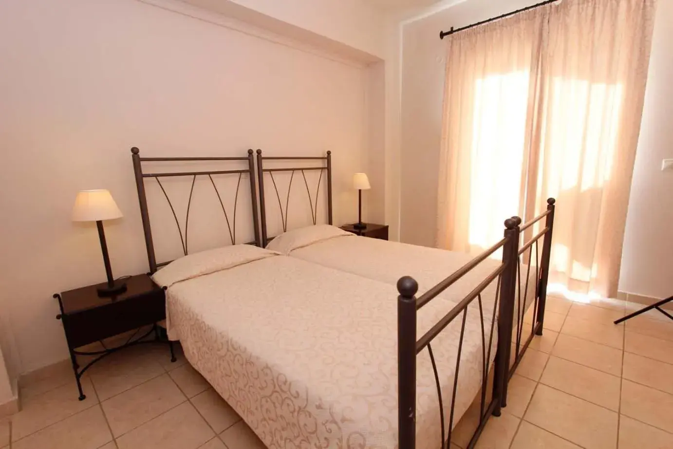 Photo of the whole room, Bed in Lambrinos Suites Photo of the whole room, Bed in Lambrinos Suites