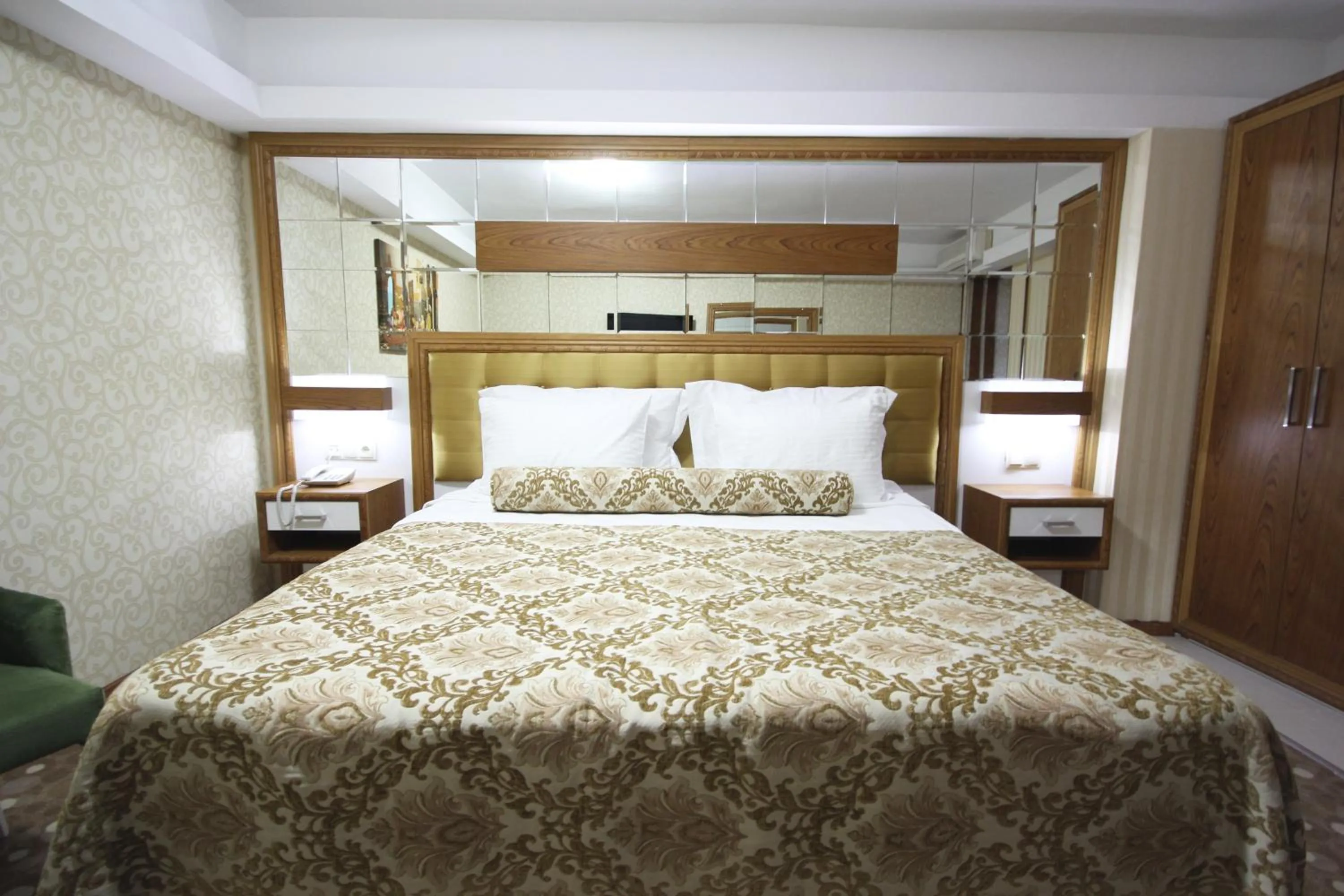 Bed in Grand Corner Boutique Hotel