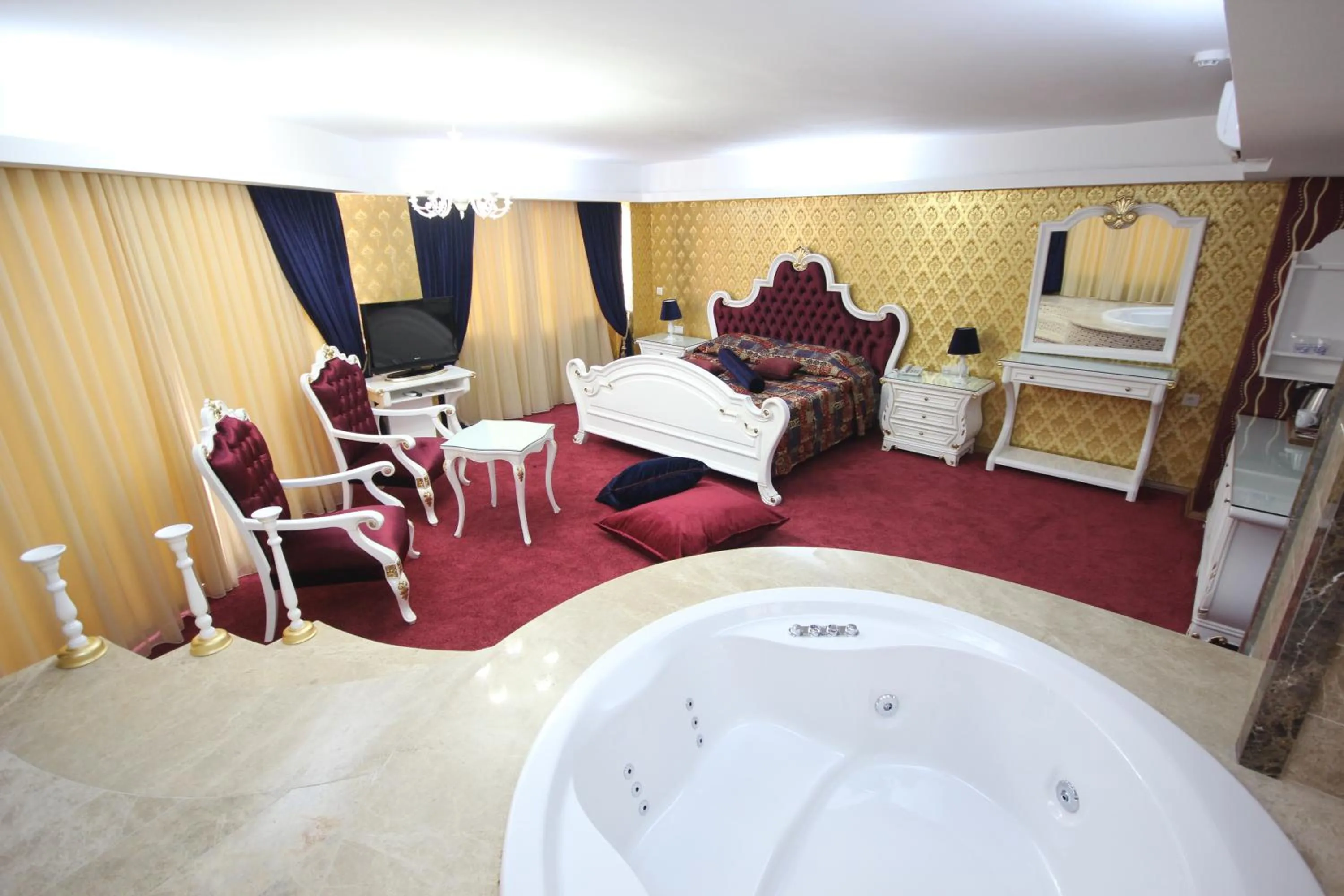 Bed in Grand Corner Boutique Hotel