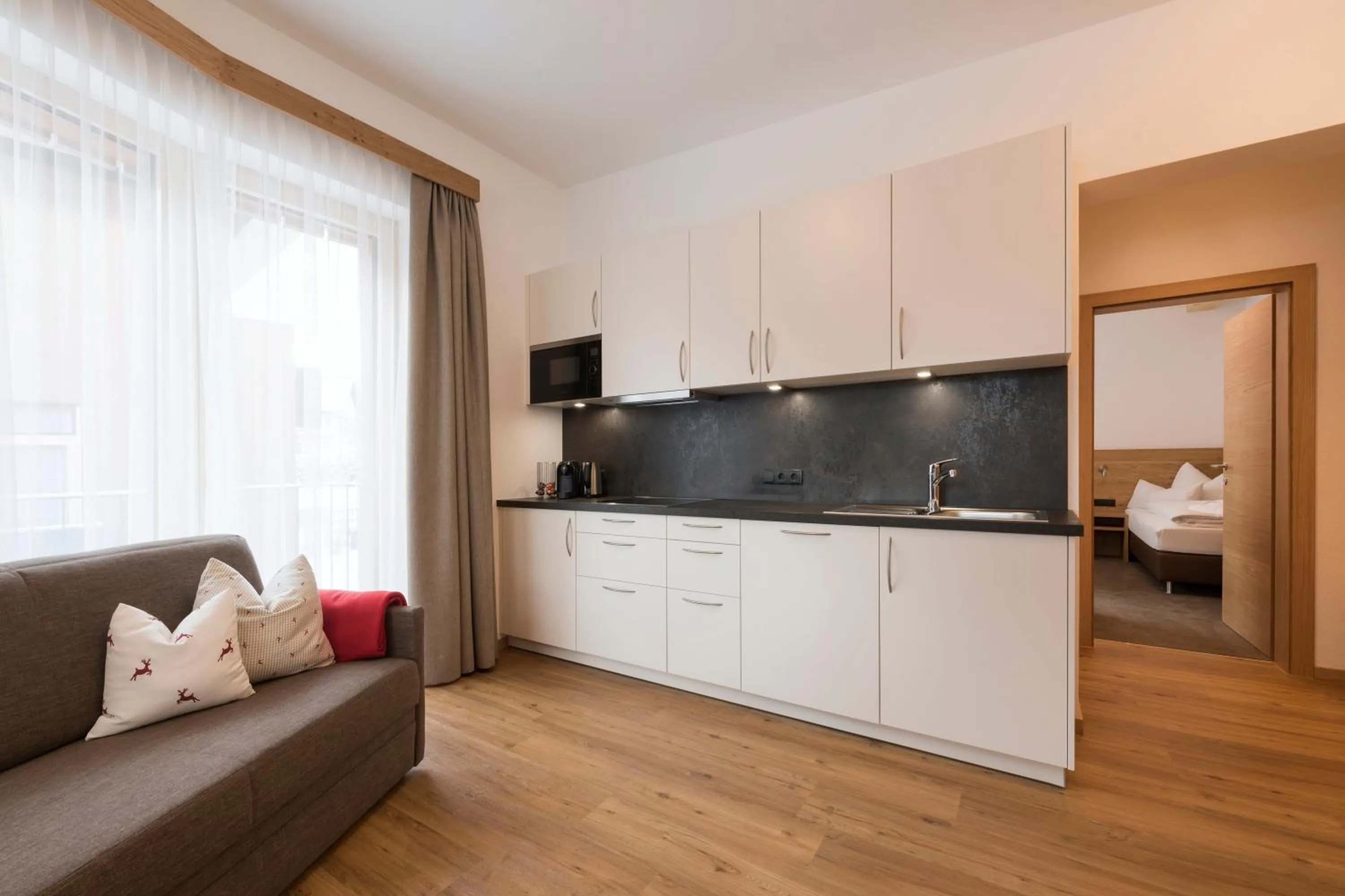 Kitchen or kitchenette, Bed in Alpenleben