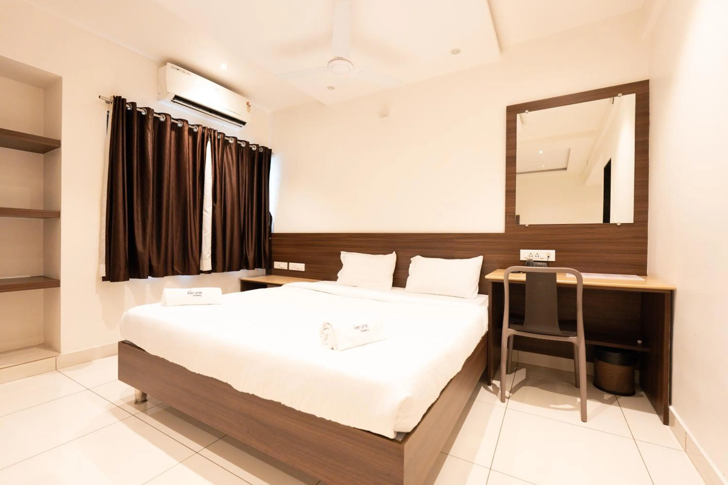 Bed in Hotel Karuna Residency