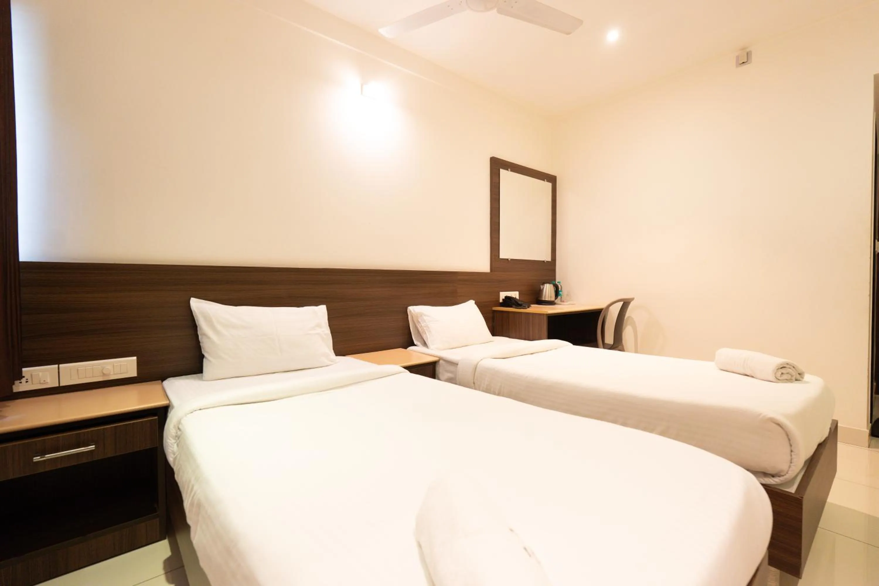 Bed in Hotel Karuna Residency