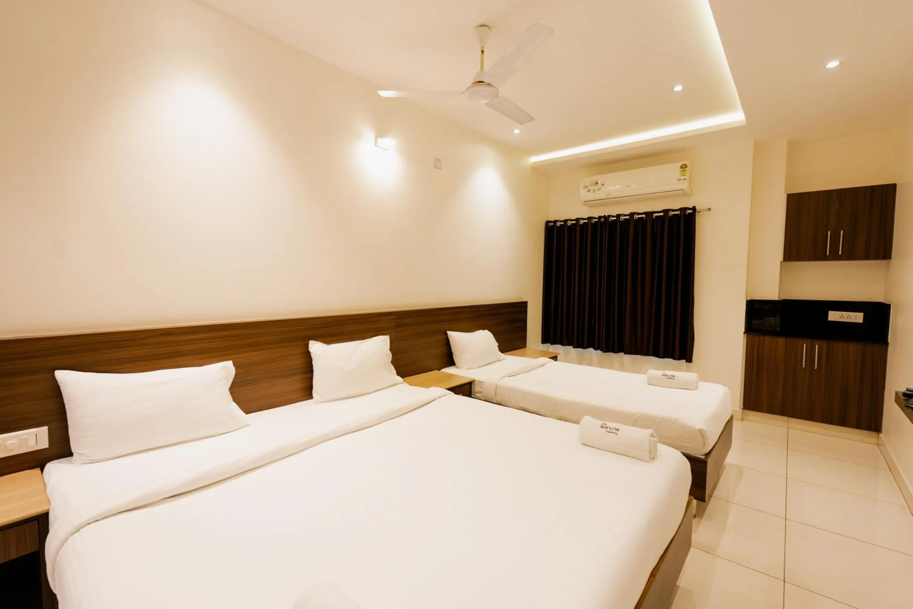 Bed in Hotel Karuna Residency