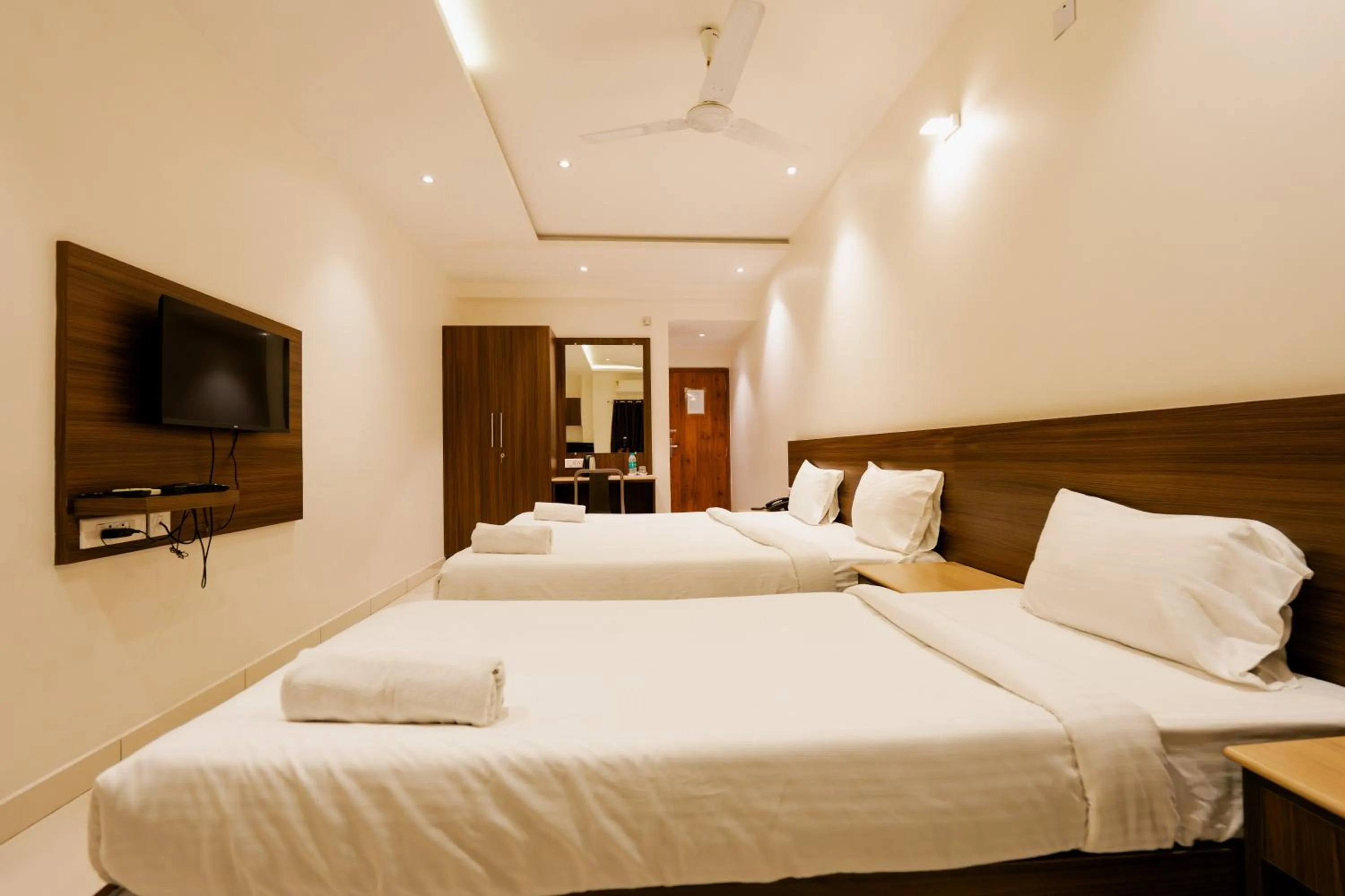 Bed in Hotel Karuna Residency