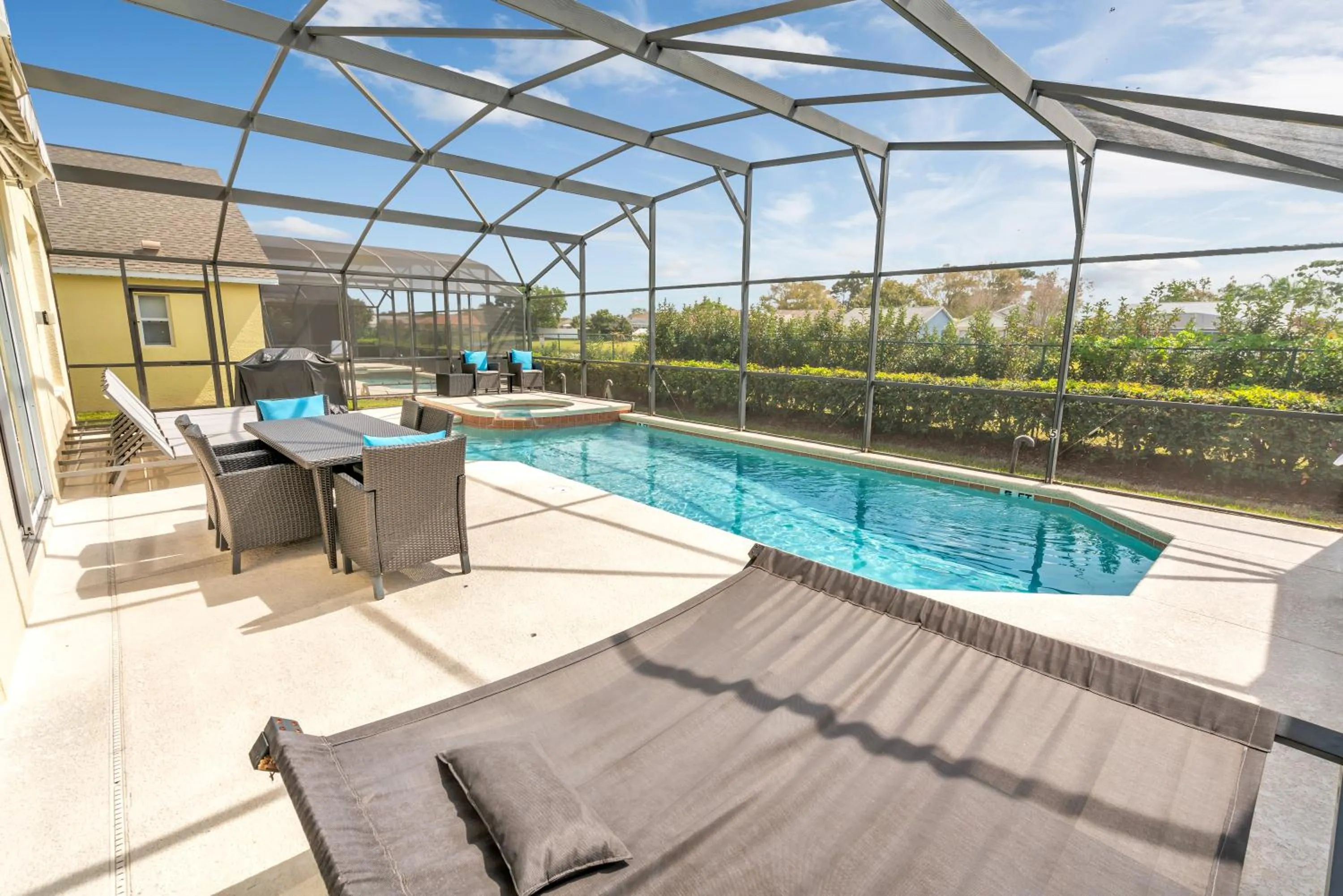 Patio in Disney Dream with Hot Tub, Pool, Xbox, Games Room, Lakeview, 10 min to Disney, Clubhouse