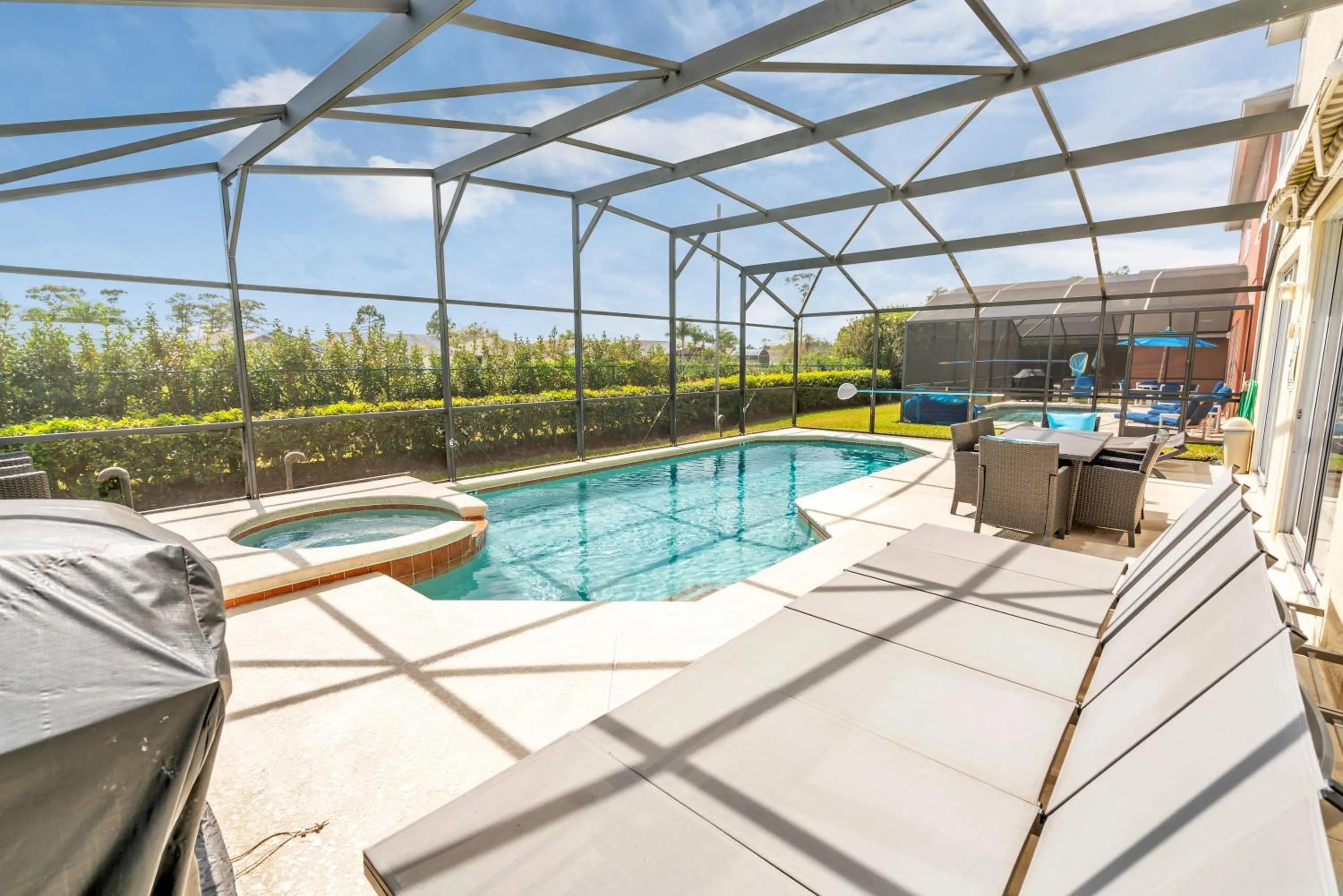 Patio in Disney Dream with Hot Tub, Pool, Xbox, Games Room, Lakeview, 10 min to Disney, Clubhouse