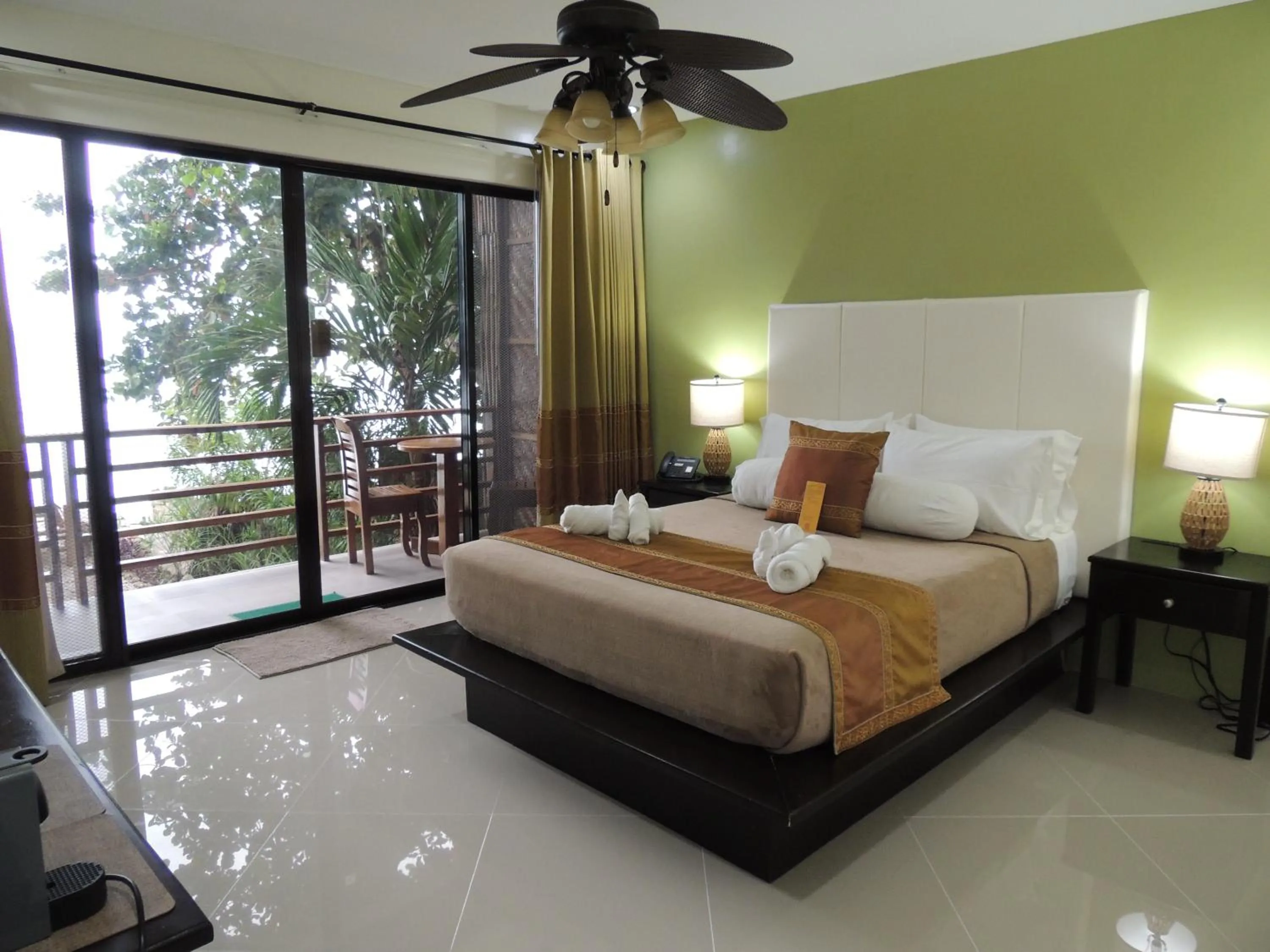 View (from property/room), Bed in AJ's Place Beach Resort