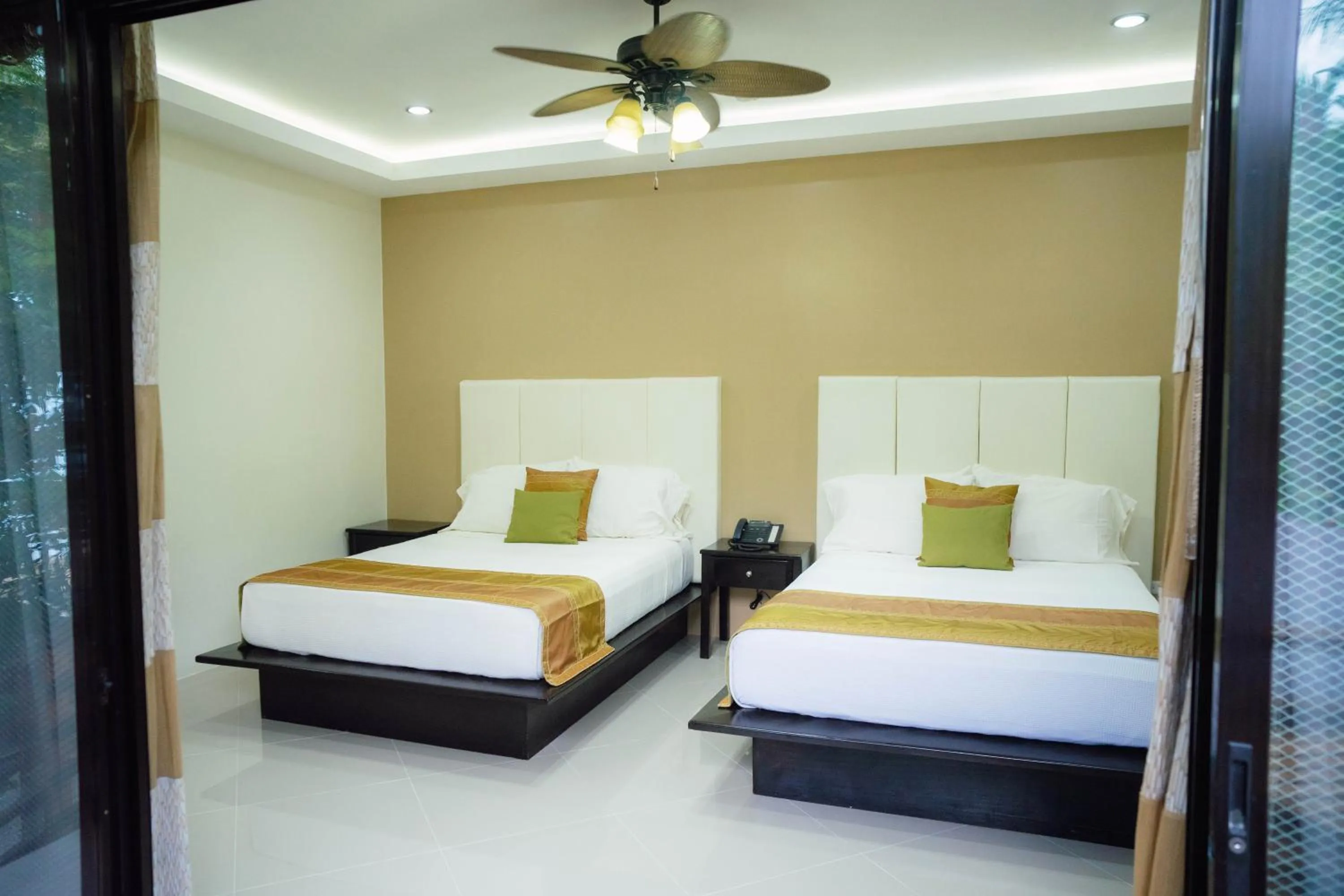 Bed in AJ's Place Beach Resort